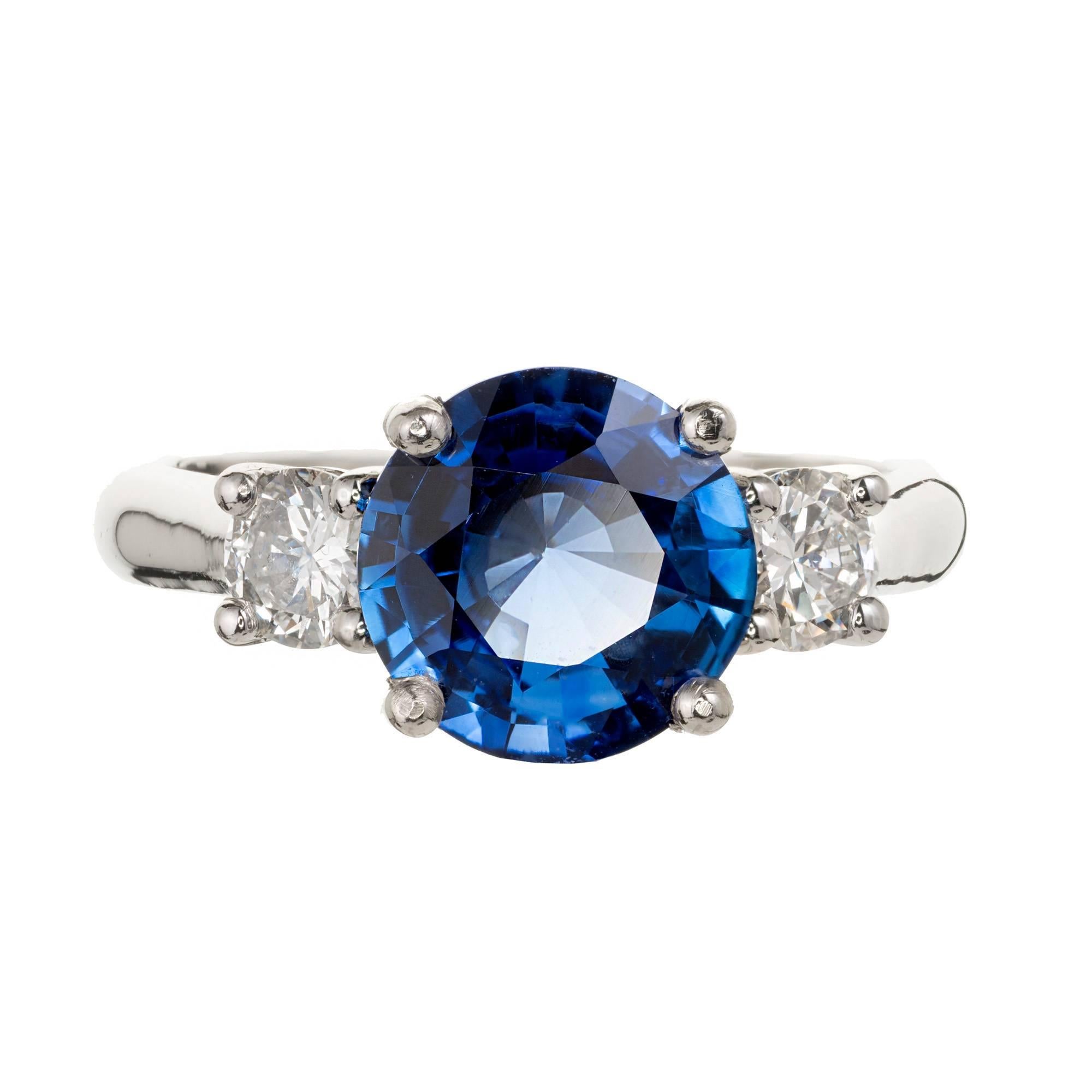 Peter Suchy blue Ceylon Sapphire Platinum diamond three-stone engagement ring. Round bright blue GIA certified natural Sapphire simple heat only. Classic Platinum diamond 3 stone setting.

1 round blue Ceylon Sapphire, approx. total weight 2.19cts,