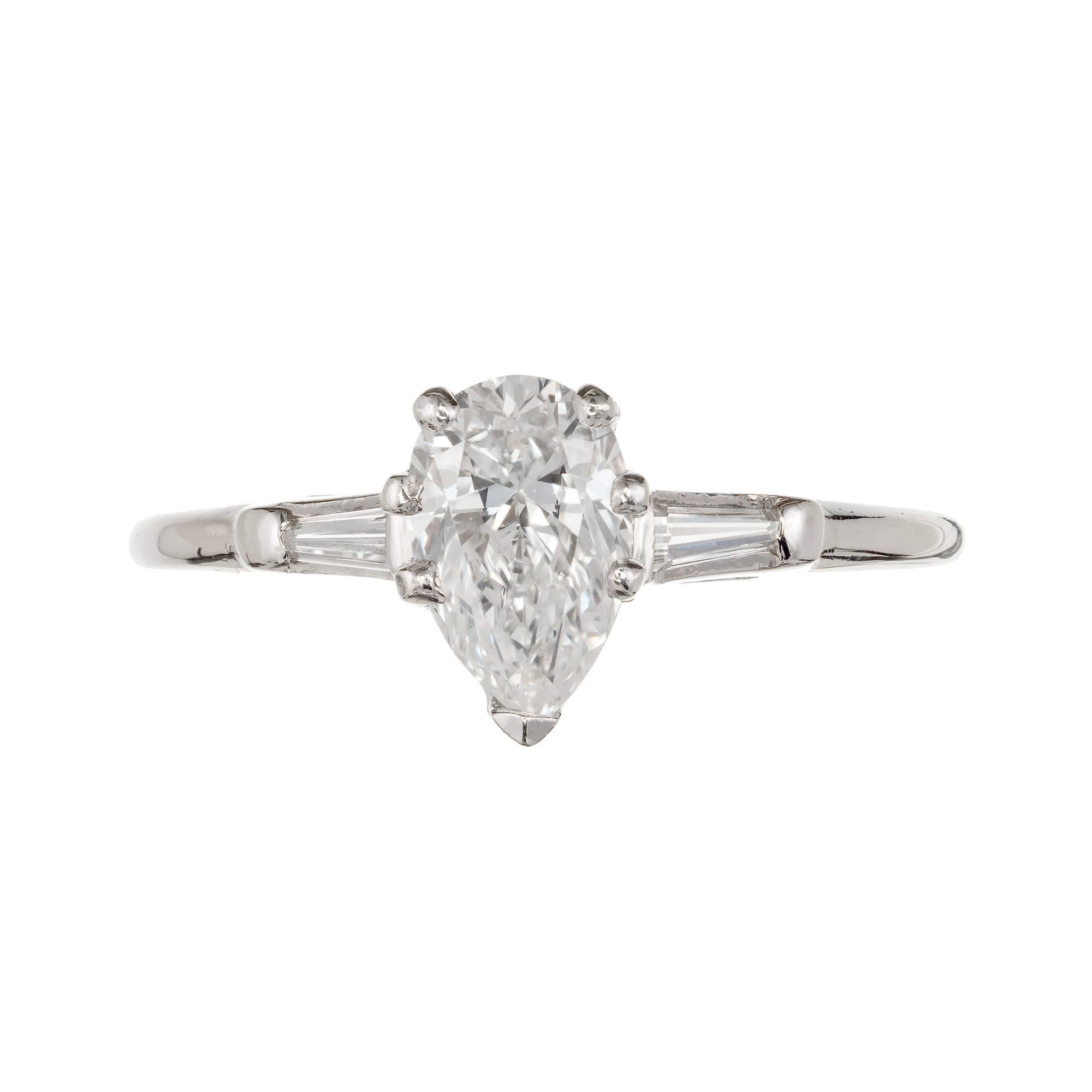EGL certified 1960s pear shaped diamond three-stone engagement ring with tapered baguette side diamonds in a 14k white gold setting.

1 pear shaped diamond, approx. total weight .58cts, F – G,   VS1 EGLCert# US 313341601D
2 tapered baguette