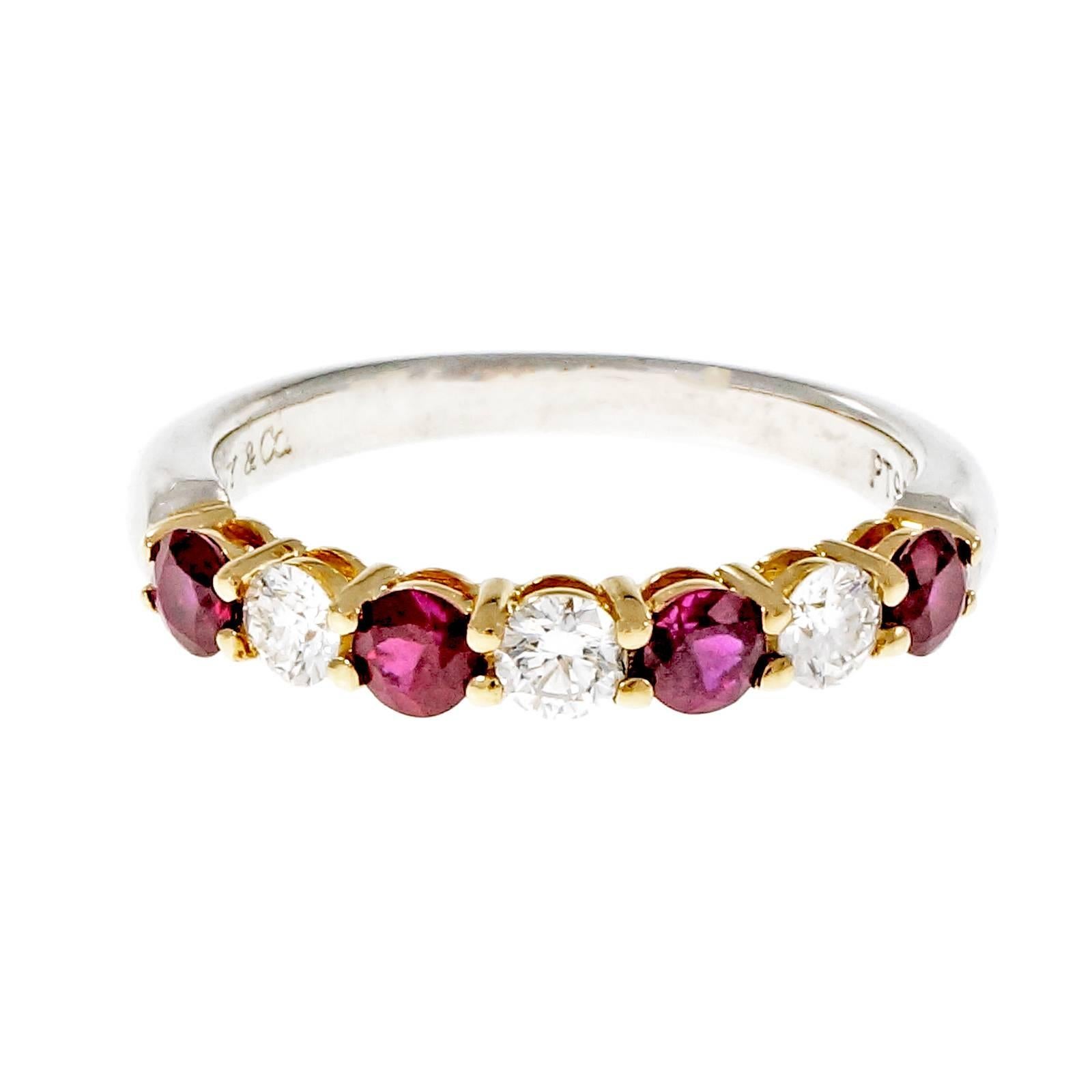 Tiffany & Co common prong wedding band ring with rubies and diamonds. 

4 round bright red Rubies, approx. total weight .50cts, VS, 2.65mm
3 round Ideal full cut diamonds, approx. total weight .24cts, F, VS
Platinum & 18k yellow gold
Tested: