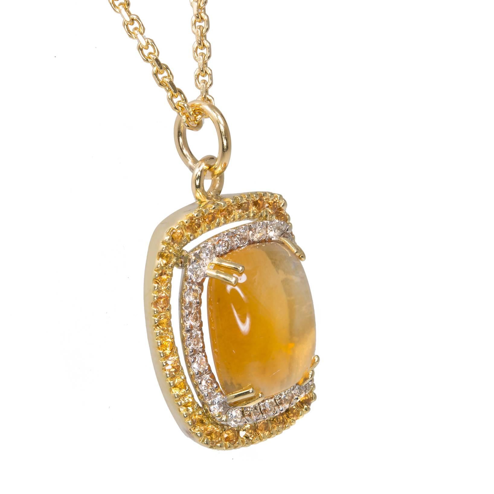 18k yellow gold necklace and chain set with a cabochon Citrine, diamonds and yellow Sapphires around it.

1cushion cabochon yellow Citrine, approx. total weight 5.00cts, 12.58 x 10.20 x 6.40mm
32 round yellow Sapphires, approx. total weight