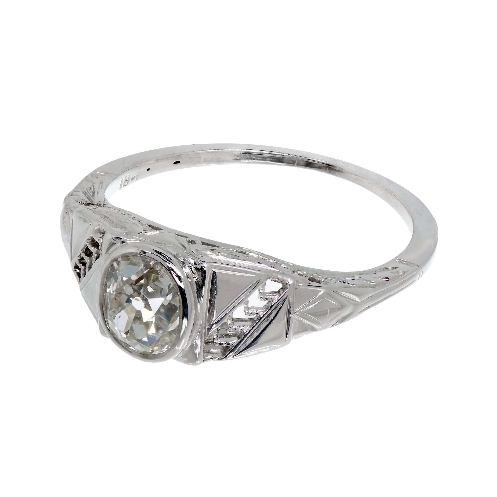 Art Deco 1930s 18k white gold engagement ring set with and old mine brilliant cut diamond cushion shape cut

1 old mine brilliant cut diamond, approx. total weight .82cts, I – J, SI2,
Size 6.25 and sizeable
18k white gold
2.4 grams
Tested and
