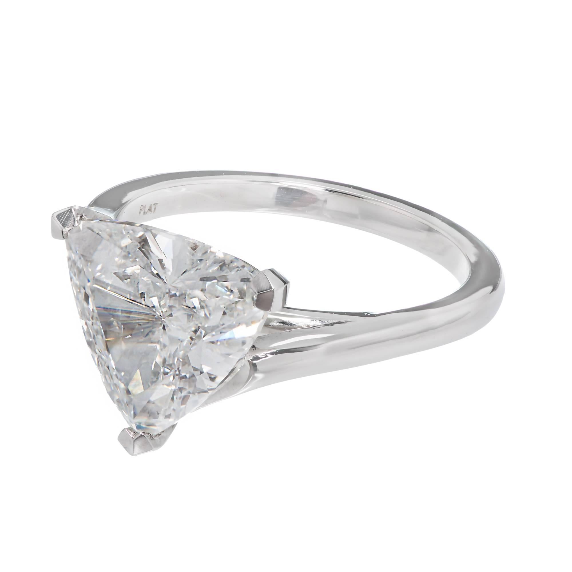 Peter Suchy swirl custom design Platinum solitaire engagement ring. Trilliant cut 3.04ct extra bright diamond. The setting allows a wedding band to sit flush from all sides. The was designed and crafted by the Peter Suchy Workshop, and designed just