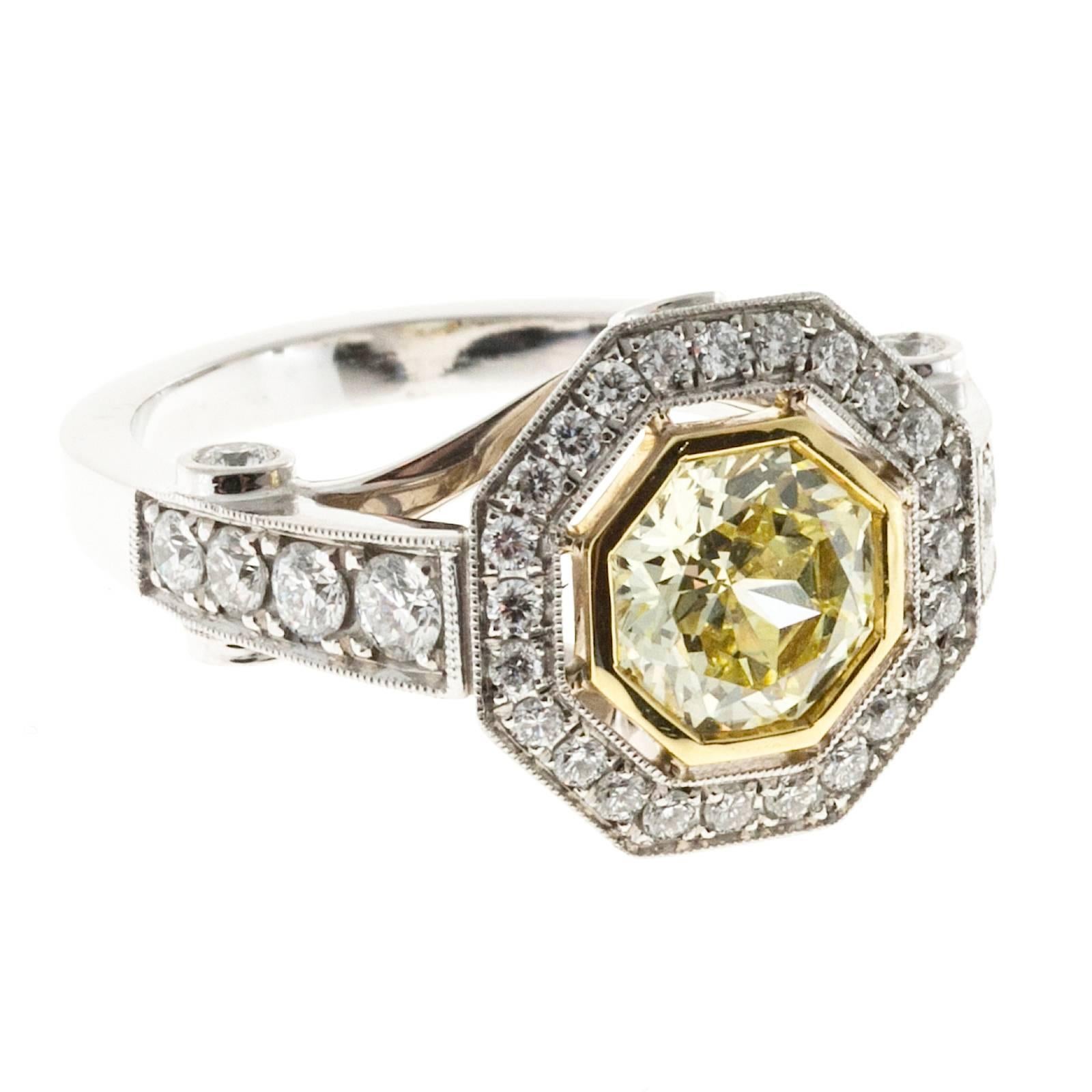 8 sided natural yellow diamond with white diamond halo platinum engagement ring designed just for this stone by the Peter Suchy Design Workshop. EGL Cert #US 69676501D

1 octagonal 8 sided natural light to fancy light yellow diamond, approx. total