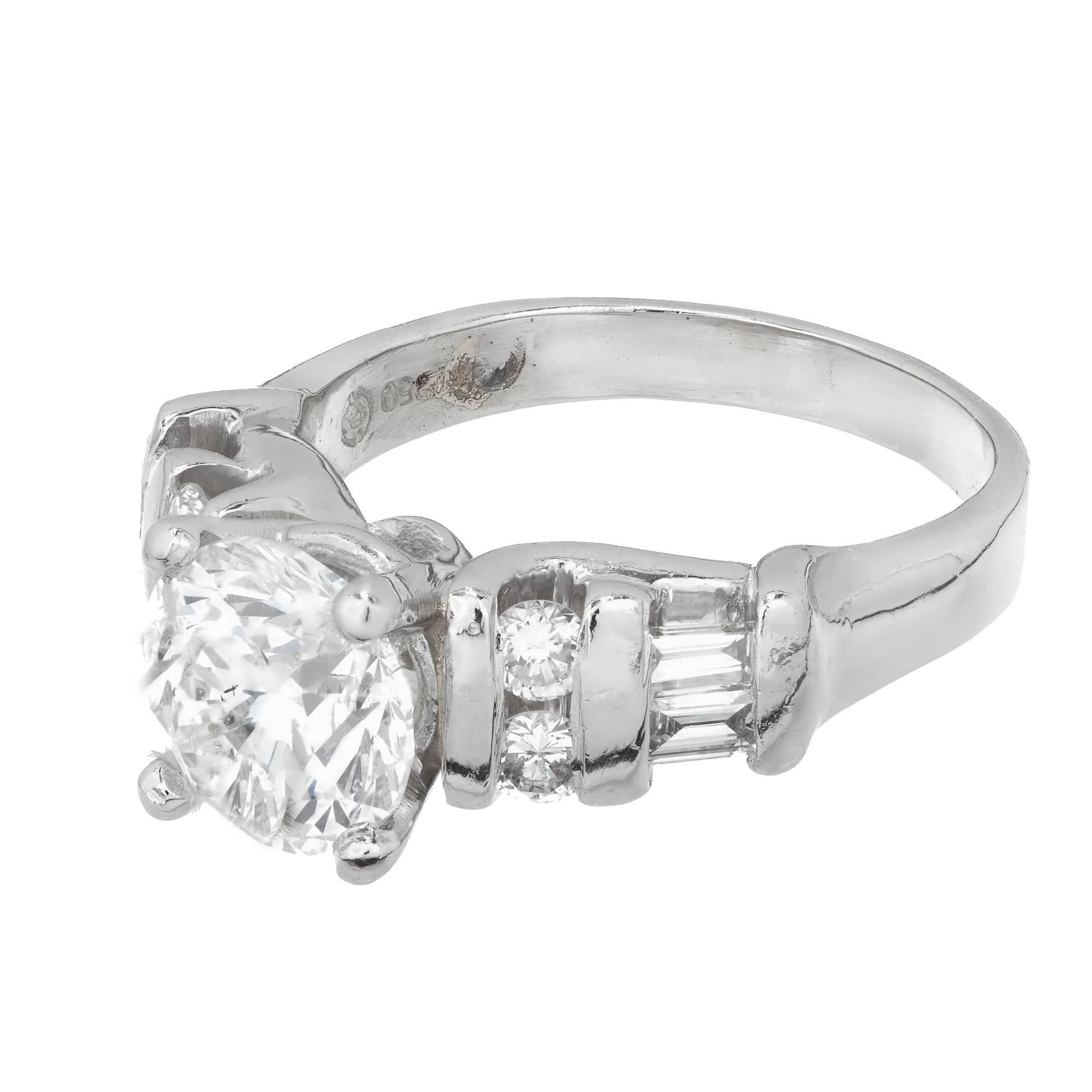 EGL certified diamond engagement ring accented by round and baguette diamonds in a platinum setting. The sides are fairly low to the finger. The center diamond is raised just enough to sparkle.

 Diamond, approx. total weight 2.00cts, G, SI3, 7.92 x