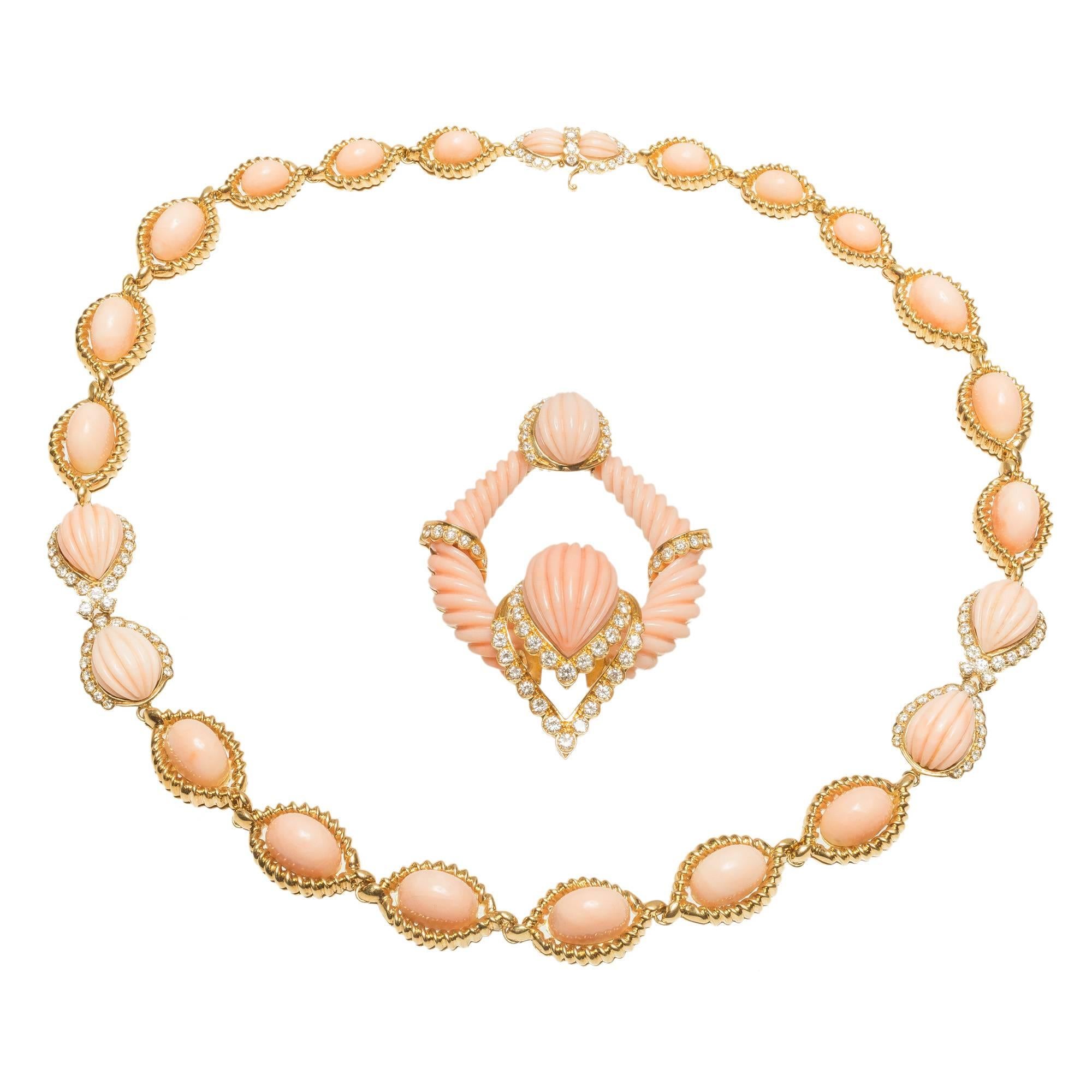 Coral and diamond pendant necklace. Natural 1950's certified untreated light pink orange Coral and diamond necklace with removable center pendant section can be worn in a chain or omega. Then necklace can also be worn alone. Signed EM.  18 Yellow