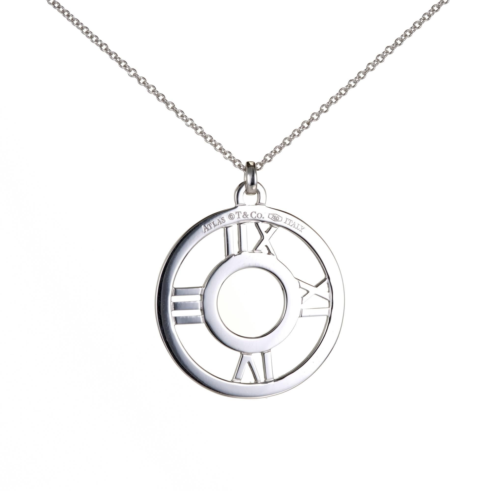 Large Tiffany & Co 18k white gold diamond Atlas numerical pendant necklace.

25 round full cut diamonds, approx. total weight .20ct, F-G, VS
18k white gold
Tested: 18k
Stamped: 750
Hallmark: Tiffany & Co
Diameter: 25mm
Chain: 16 inches
Depth: