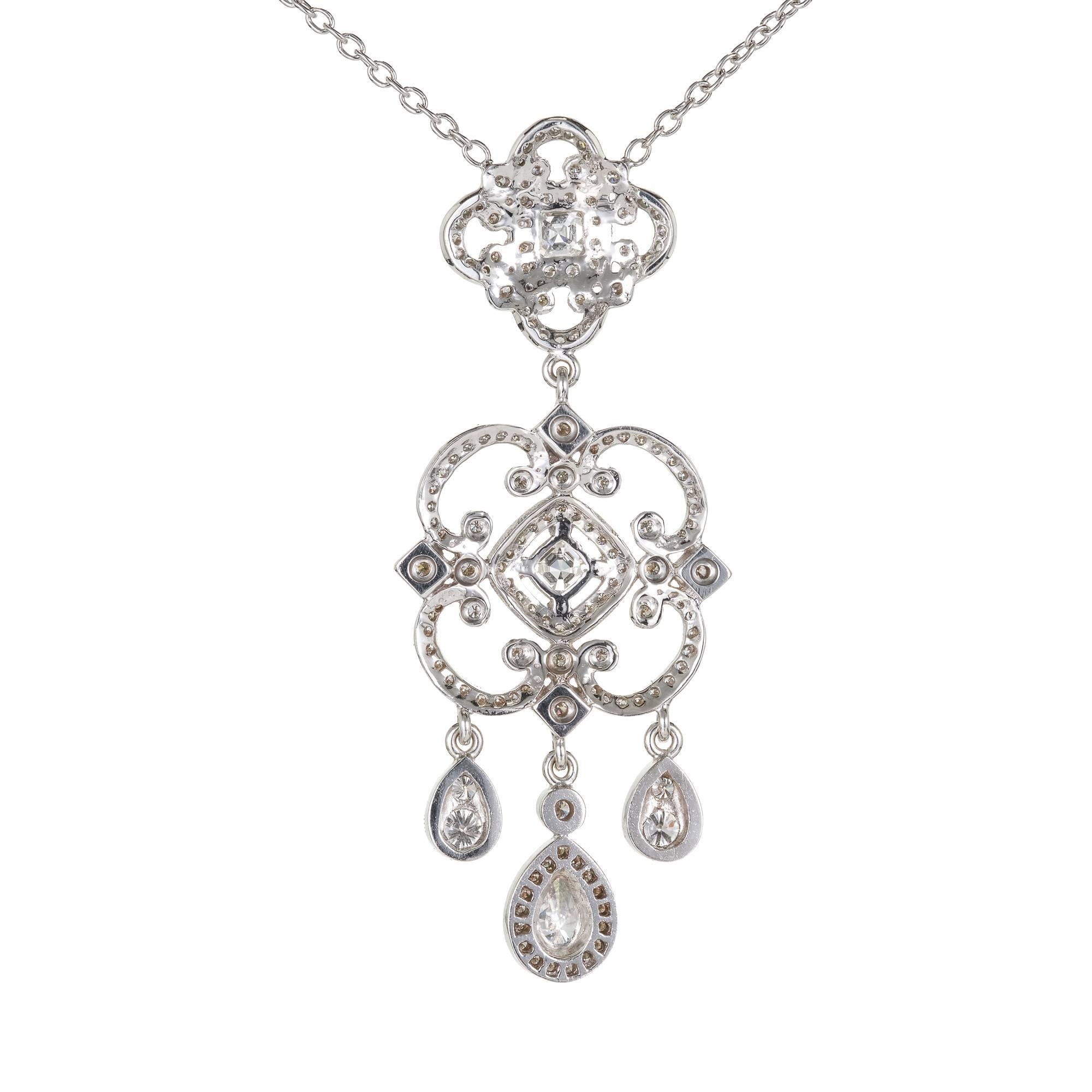 Penny Preville Chandelier style diamond pendant necklace. 18k white gold with a “Diamond by the Yard” style chain.

2 square cut diamonds, approx. total weight .30cts, G, SI1, 3.32 x 3.31mm
1 pear diamond, approx. total weight .25cts, G, SI1, 5.67 x