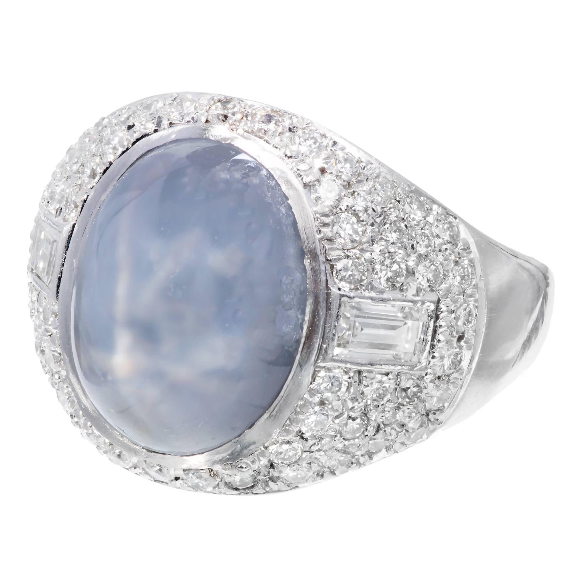 Handmade Art Deco pave diamond natural star Sapphire Platinum ring circa 1920-1930. GIA certified center cabochon oval center sapphire, with two baguette side diamonds and 60 round pave set accent diamonds. Set low to the hand. 

1 oval light violet