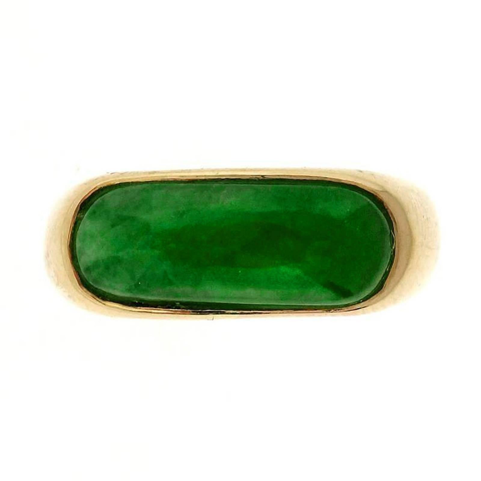 Vivid green natural no heat Jadeite Jade and Omphacite saddle ring signed MK585 with no impregnation or enhancements. Circa 1960.

1 oval bright green curved cabochon Jadeite Jade and Omphacite, excellent lustre, GIA certificate #1152955917.
14k
