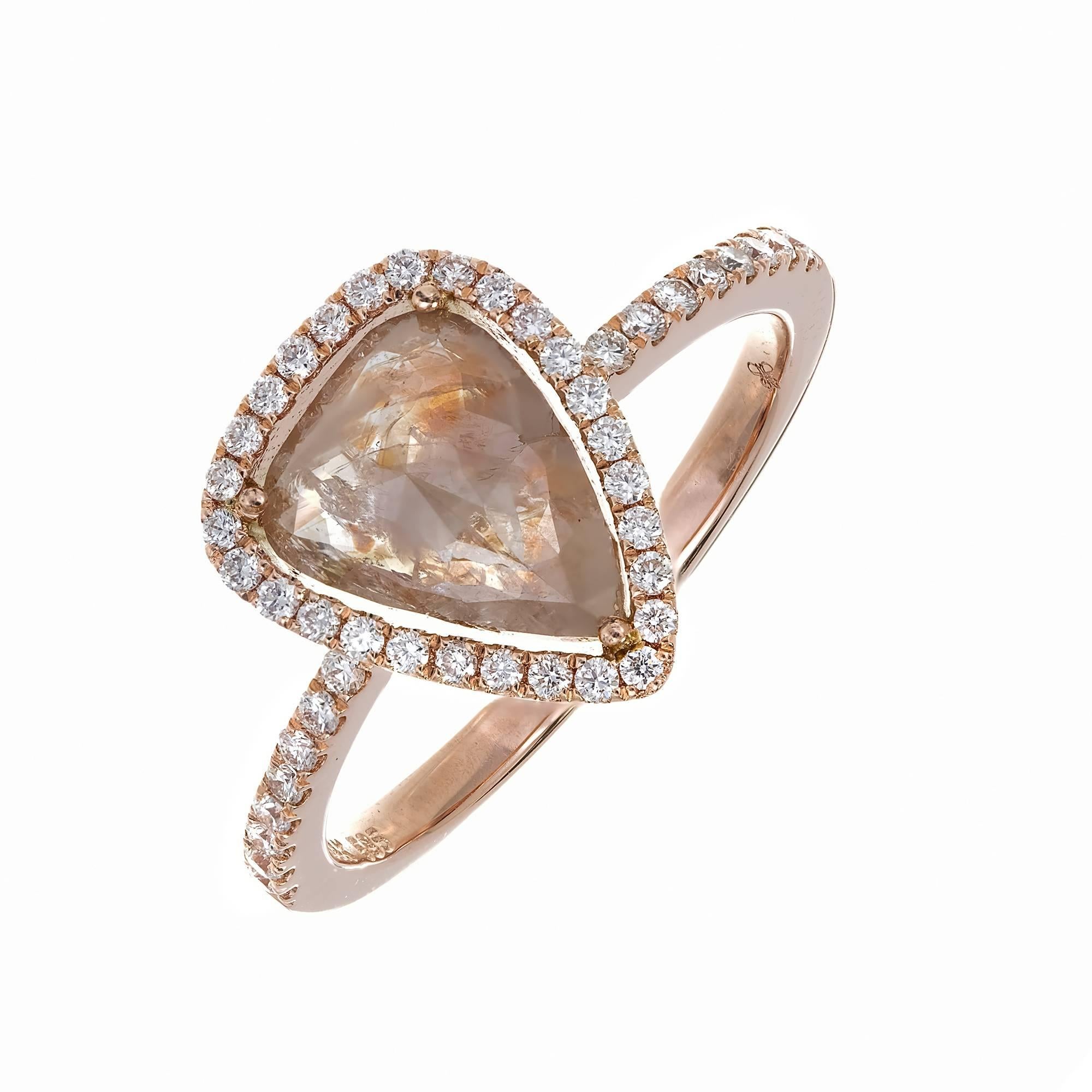 1.34 Carat Pear Diamond Rose Gold Engagement Ring. Fancy color diamond   surrounded by bright white diamonds in a 14k rose gold setting. True natural multi-color diamond yellow, pink and brown.

1 pear rose cut natural multi-color diamond, approx.