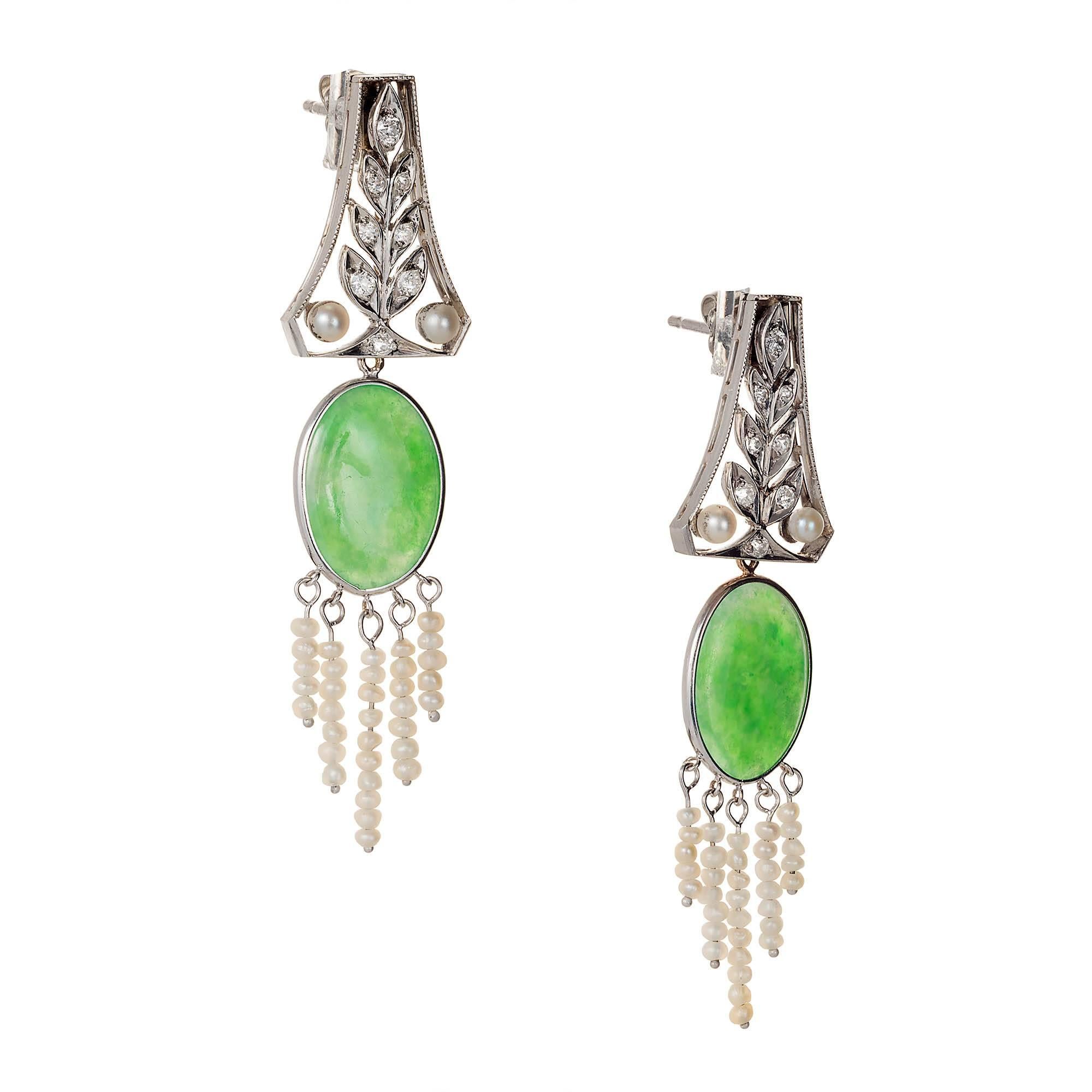 Natural jade, pearl and diamond platinum dangle earrings.  circa 1930-1940 with natural pearls and extra fine translucent natural 3.54ct, 3.11ct   Jadeite Jade dangles, with accent diamonds. 

A grade highly translucent natural oval Jadeite Jade