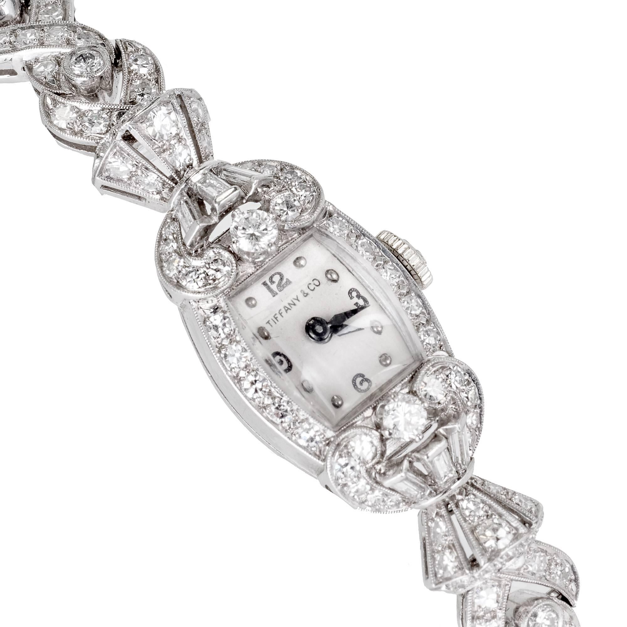 Hamilton lady's platinum and diamond bracelet wristwatch, circa 1940s. Round and baguette diamonds set in platinum. 

151 round diamonds 2.30cts, F to G color, VS. 
6 baguette cut diamonds 0.15cts, F, VS. 
12 round diamonds are full cut the rest are