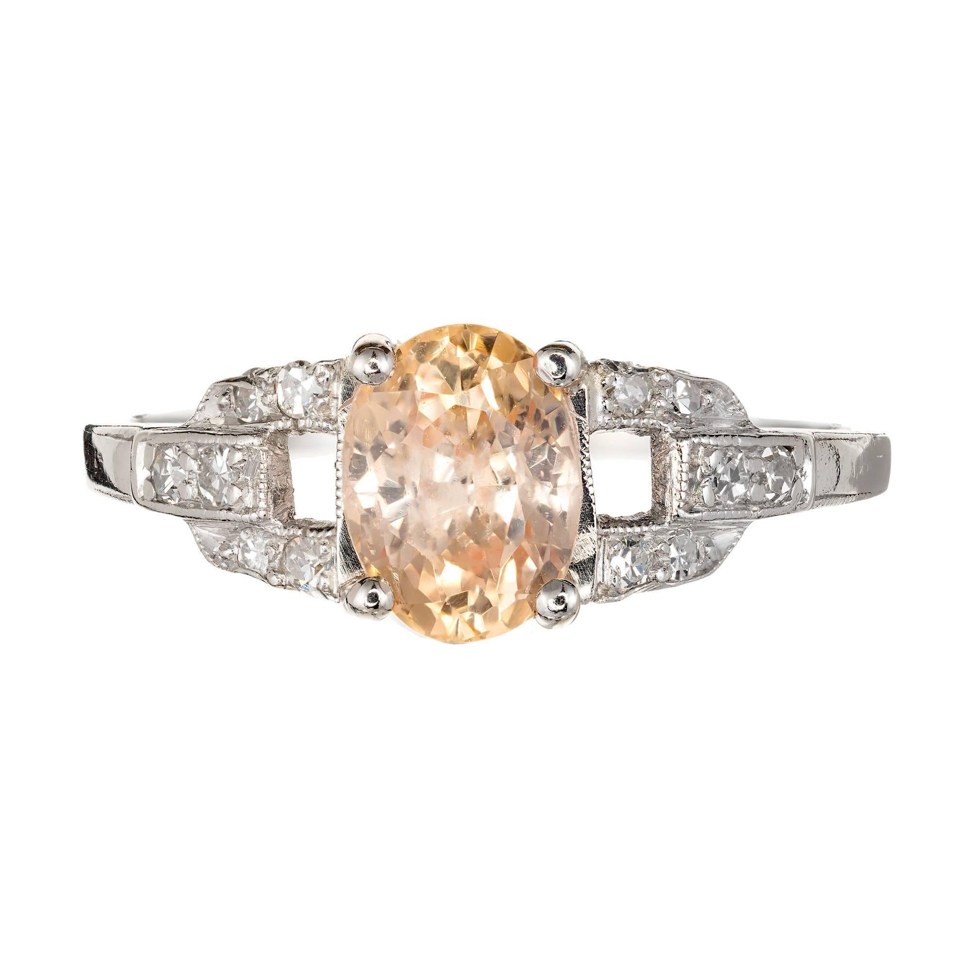 Art Deco 1930's Platinum setting with a yellow orange natural no heat no enhancement Sapphire and diamond engagement ring.  Original old European cut sapphire with raised crown and small table accented with single cut diamonds. 

1 GIA certified