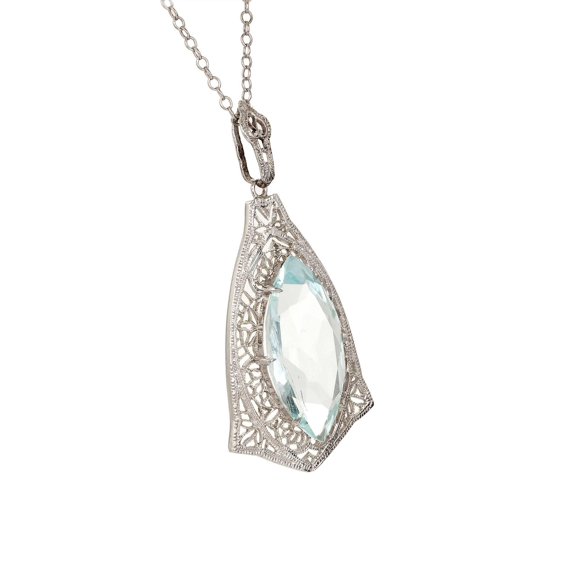 Art Deco marquise shape natural untreated 5.15 Carat Aquamarine in a filigree pendant necklace. circa 1940 

1 blue Marquise Aqua, approx. total weight 5.15cts, VS
14k White gold
Top to bottom: 36.85mm or 1.45 inches
Width: 18.34mm or .72