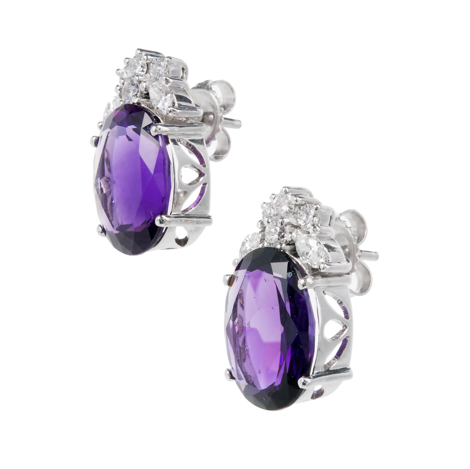 Bright deep purple Amethyst diamond earrings with bright white diamonds in 18k white gold. 

18k white gold 
2 oval deep purple Amethyst, approx. total weight 10.00cts, VS, 13.07 x 10.03 x 6.33mm 
8 round diamonds, approx. total weight .24cts, H, VS