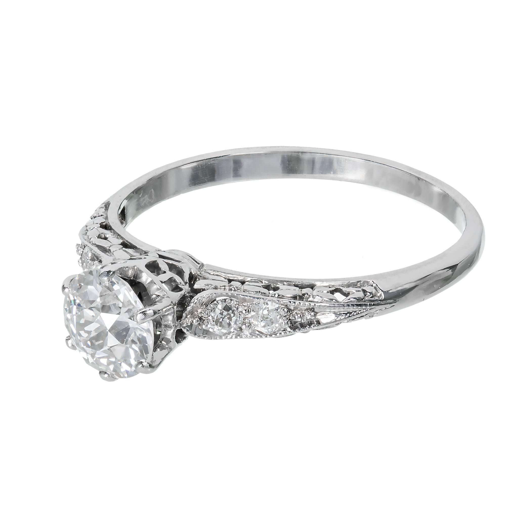Original vintage filigree engagement ring, in a handmade platinum setting.  GIA certified diamonds, bright and sparkly. Circa 1910.

1 Old European cut diamond H VS2 approximately .70 carats.  GIA Certificate # 2185227774
4 Old European cut diamonds
