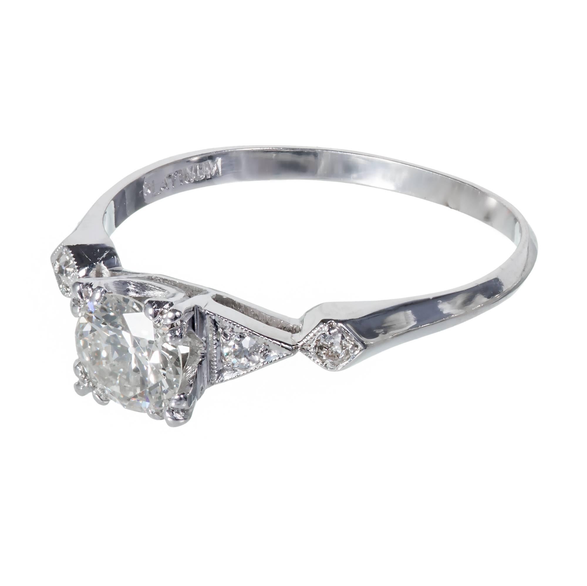 Original platinum diamond engagement ring with diamond side stones in its original platinum setting. Circa 1940.

1 Transitional Diamond J-K SII approximately .75 carats. EGL certificate # US 313785601D 
4 round diamonds H SII approximately .08