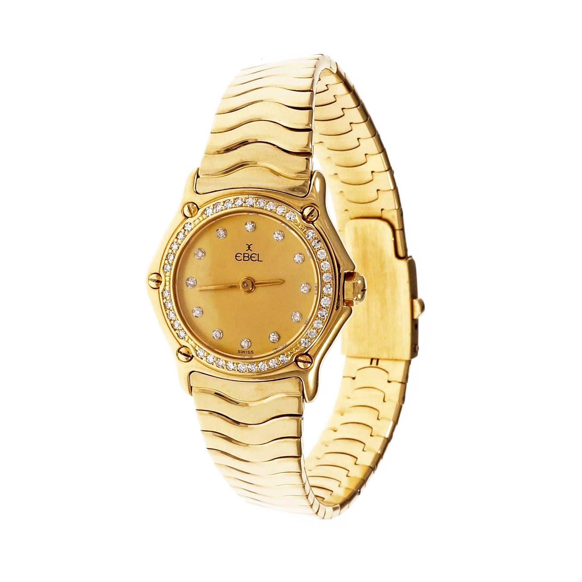 Ladies Ebel Wave wrist watch. All original with solid 18k case and band. Diamond bezel and Diamond dial.

45 diamonds aprox. total weight: .50ct. 
18k yellow gold
Band length: 6 3/8 inches
58.5 grams
Length: 26mm
Width: 23mm
Band width at case: