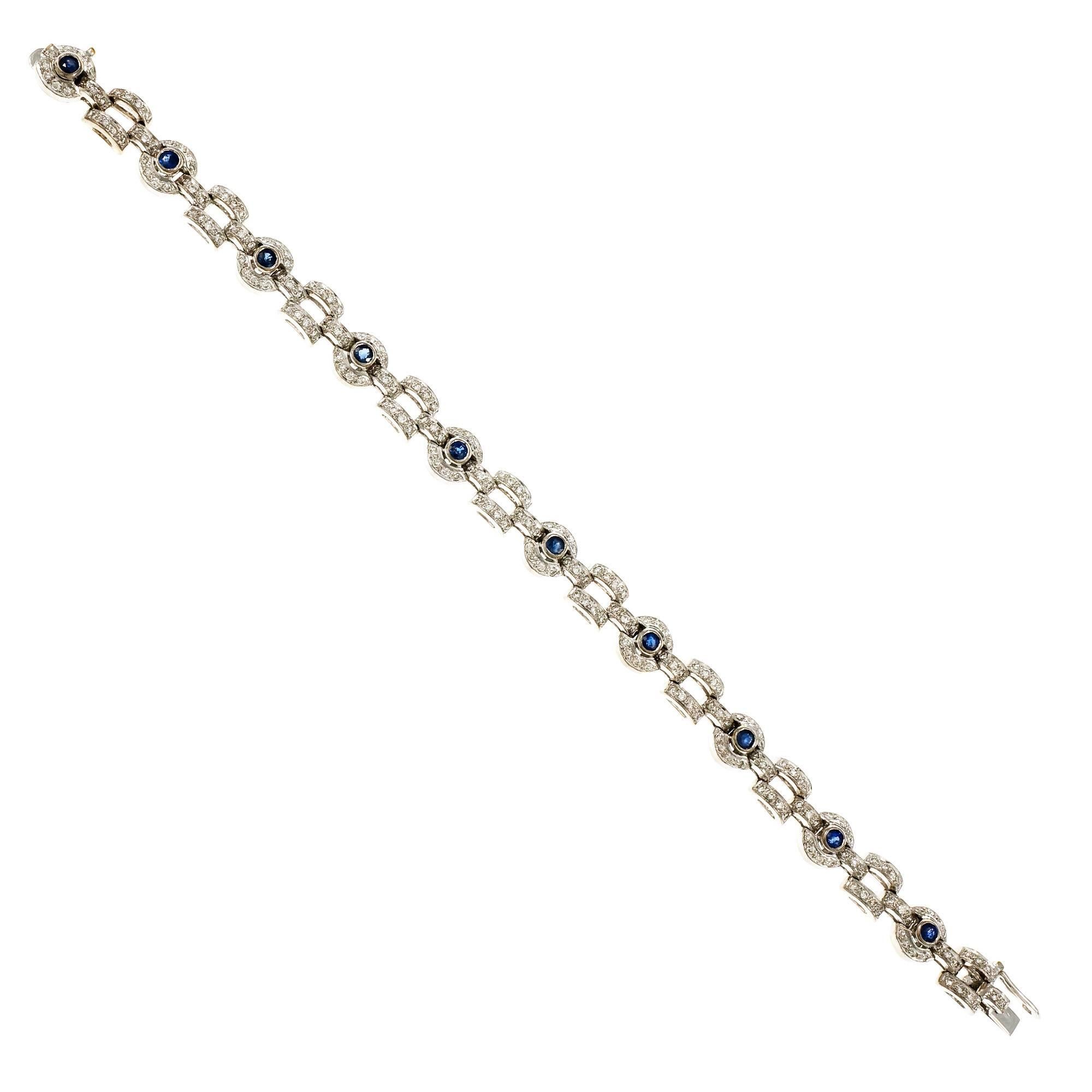 Circle and square link design Sapphire and bright full cut Diamond 18k white gold bracelet. Hidden built in catch and side lock safety.

180 round full cut Diamonds, approx. total weight .90cts, G, SI
10 round blue Sapphires, approx. total weight