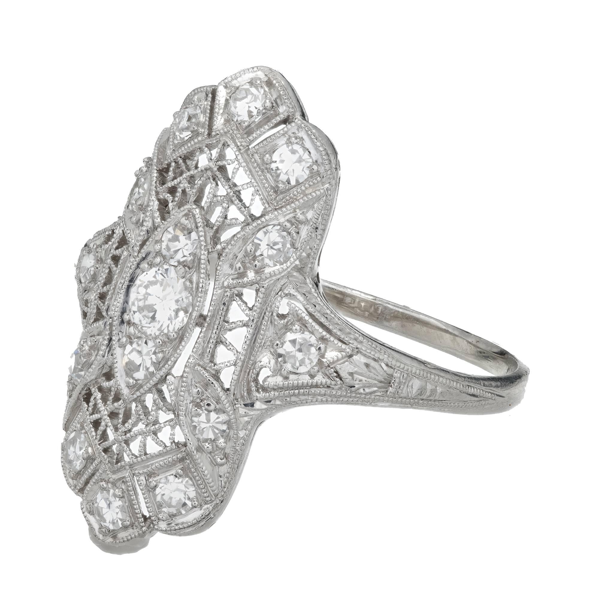 Art Deco filigree Edwardian diamond cocktail ring in a platinum setting with  quality diamonds and workmanship. Beautiful piercing and hand engraving.

1 round full cut diamond, approx. total weight .06ct, F, VS
14 single cut diamonds, approx. total