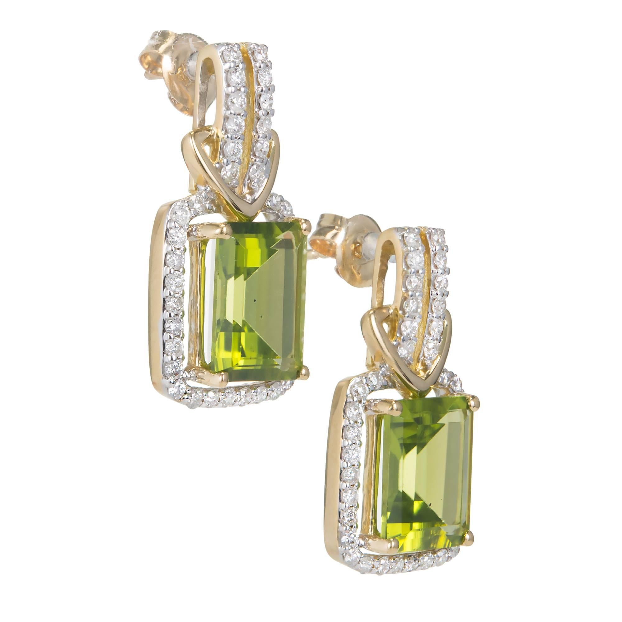 Emerald cut Peridot diamond halo 18k yellow gold earrings.

76 round diamonds, approx. total weight .75cts, G – H, VS
2 Emerald cut green Peridot, approx. total weight 7.50cts, VS, 10 x 8mm
18k yellow gold
Tested: 18k
Stamped: 750
Hallmark: GBC
7.0