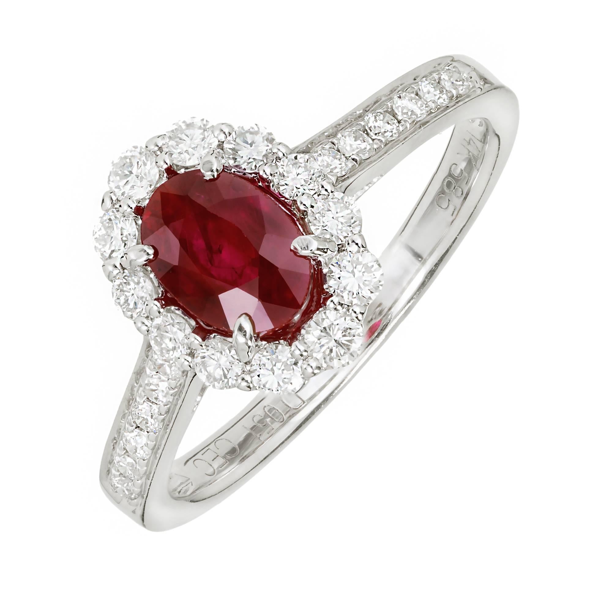 Oval Ruby Diamond halo 14k white gold engagement ring.

1 oval red Ruby, approx. total weight .88cts
24 round full cut Diamonds, approx. total weight .51cts, G, VS
Size 7 and sizable
14k white gold
Tested: 14k
Stamped: 14k 585
3.0 grams
Width at