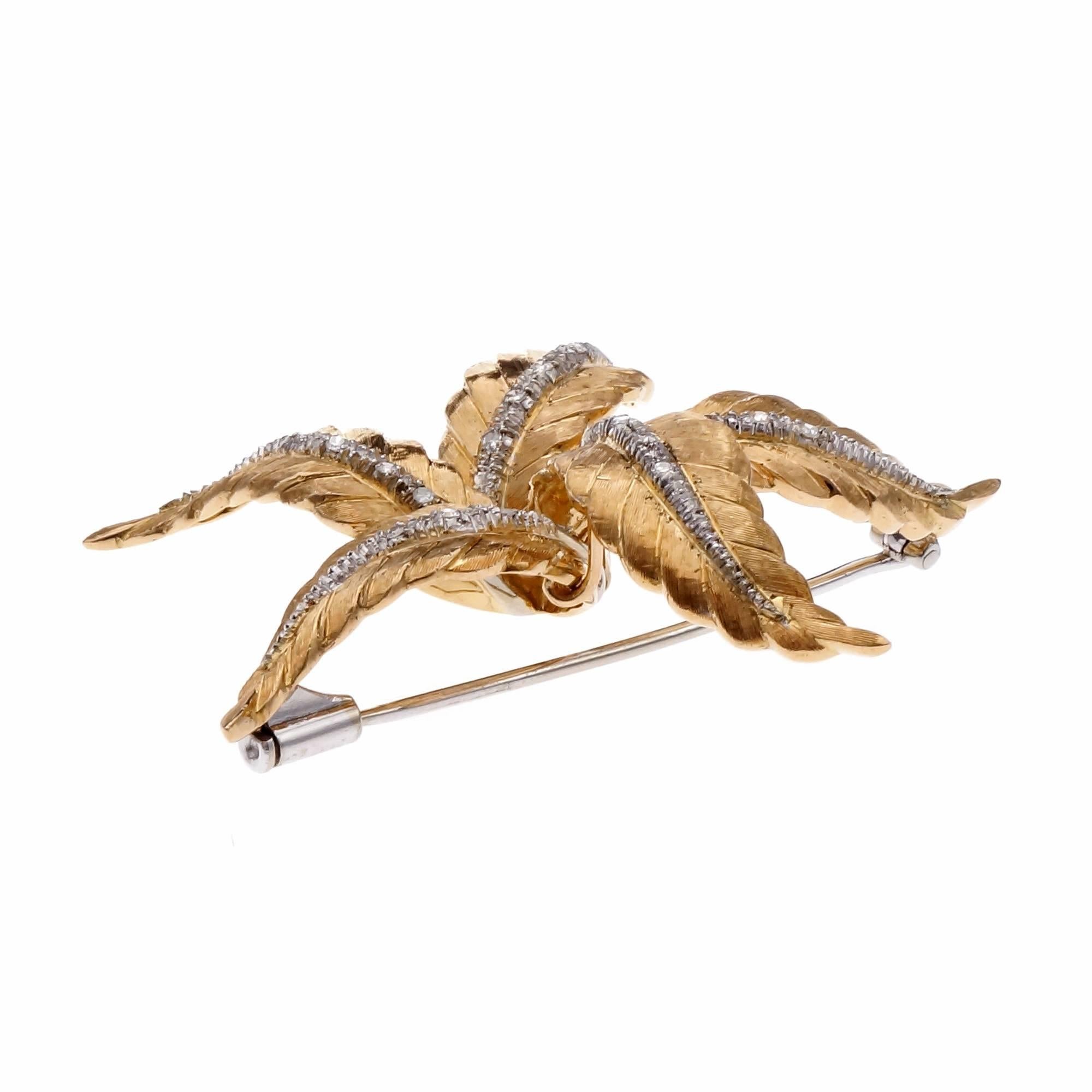 Vintage 1960's Mid-Century textured gold Spitzer & Furman star brooch. A piece that effortlessly combines elegance and charm. Each 18k yellow gold textured leaf is adorned with a strip 18k white gold featuring round sparkling diamonds. Expertly