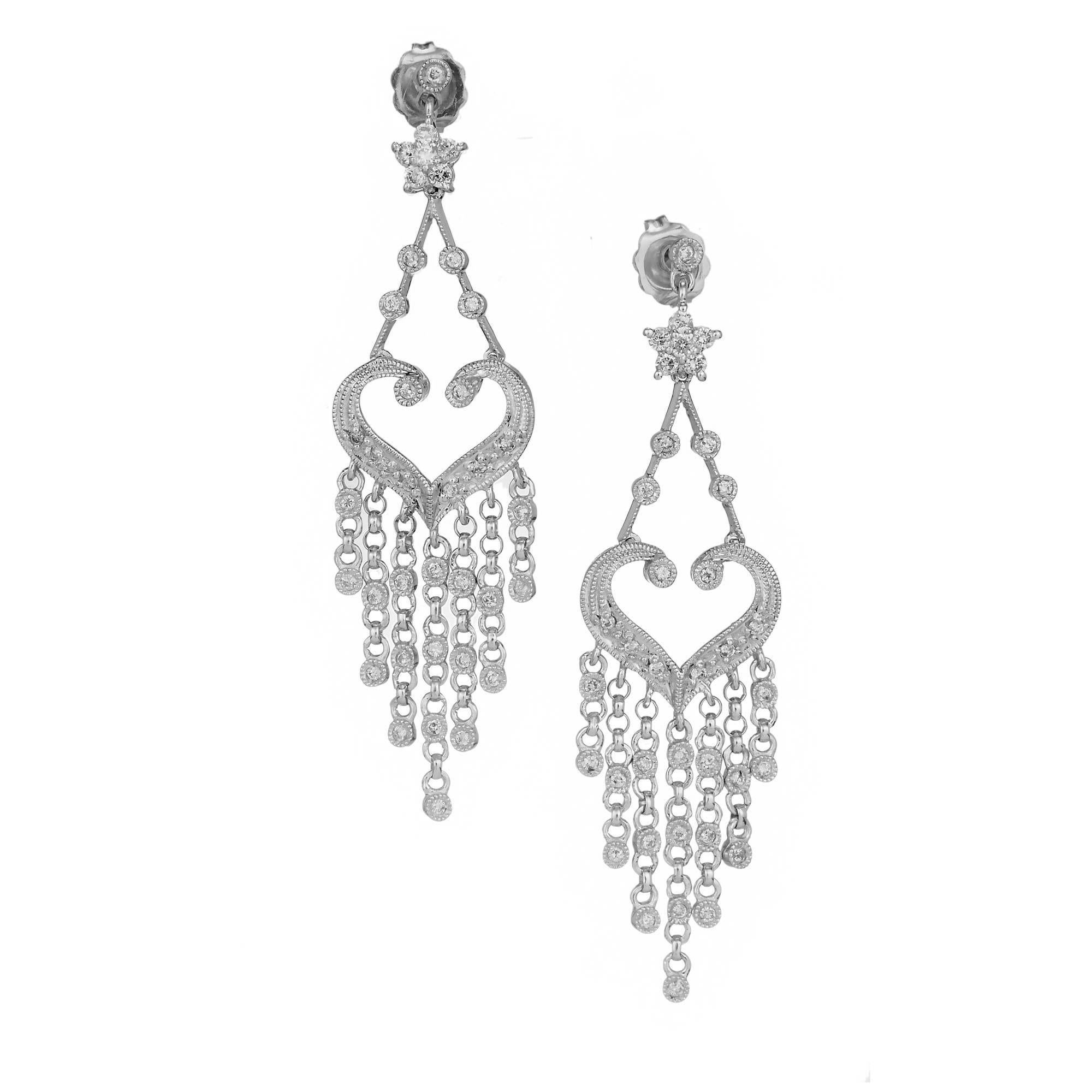 Chandelier style dangle earrings with full cut Diamonds in 14k white gold.

74 round Diamonds, approx. total weight .58cts, H, SI1
14k white gold
6.4 grams
Tested: 14k
Stamped: 585
Hallmark: 029
Top to bottom: 50.85mm or 2.0 inches
Width: 13.70mm or