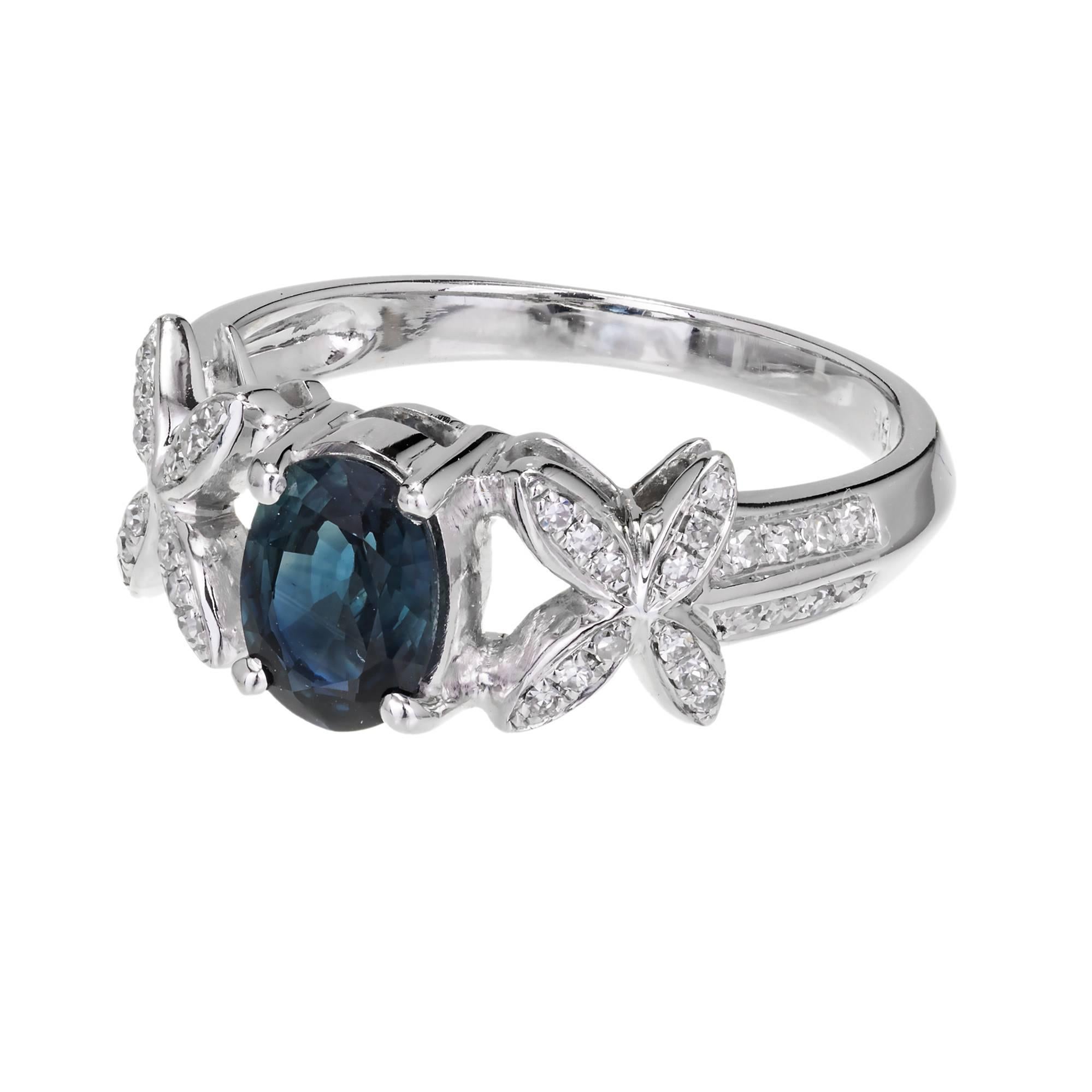 Blue oval natural corundum Sapphire in an “X” design engagement ring. 18k white gold setting with Diamond accents. GIA certified simple heat only.

1 Oval sapphire, approx. total weight. 1.00cts. GIA Certificate# 5182337720
40 single cut Diamonds,