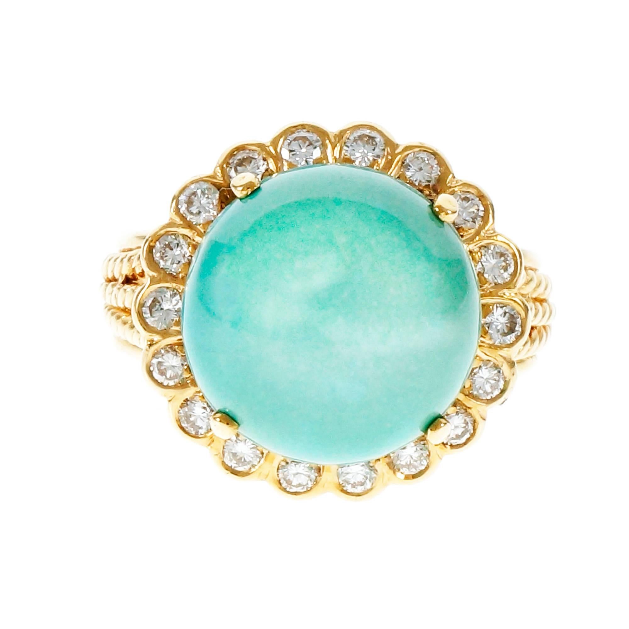Vintage 1950-1960 7.00ct Turquoise Diamond ring with bright sparkly Diamond accents. The Turquoise has natural color with Polymer coating for lustré enhancement.

1 round cabochon blue Turquoise, approx. total weight 7.07cts, 13mm
18 round Diamonds,