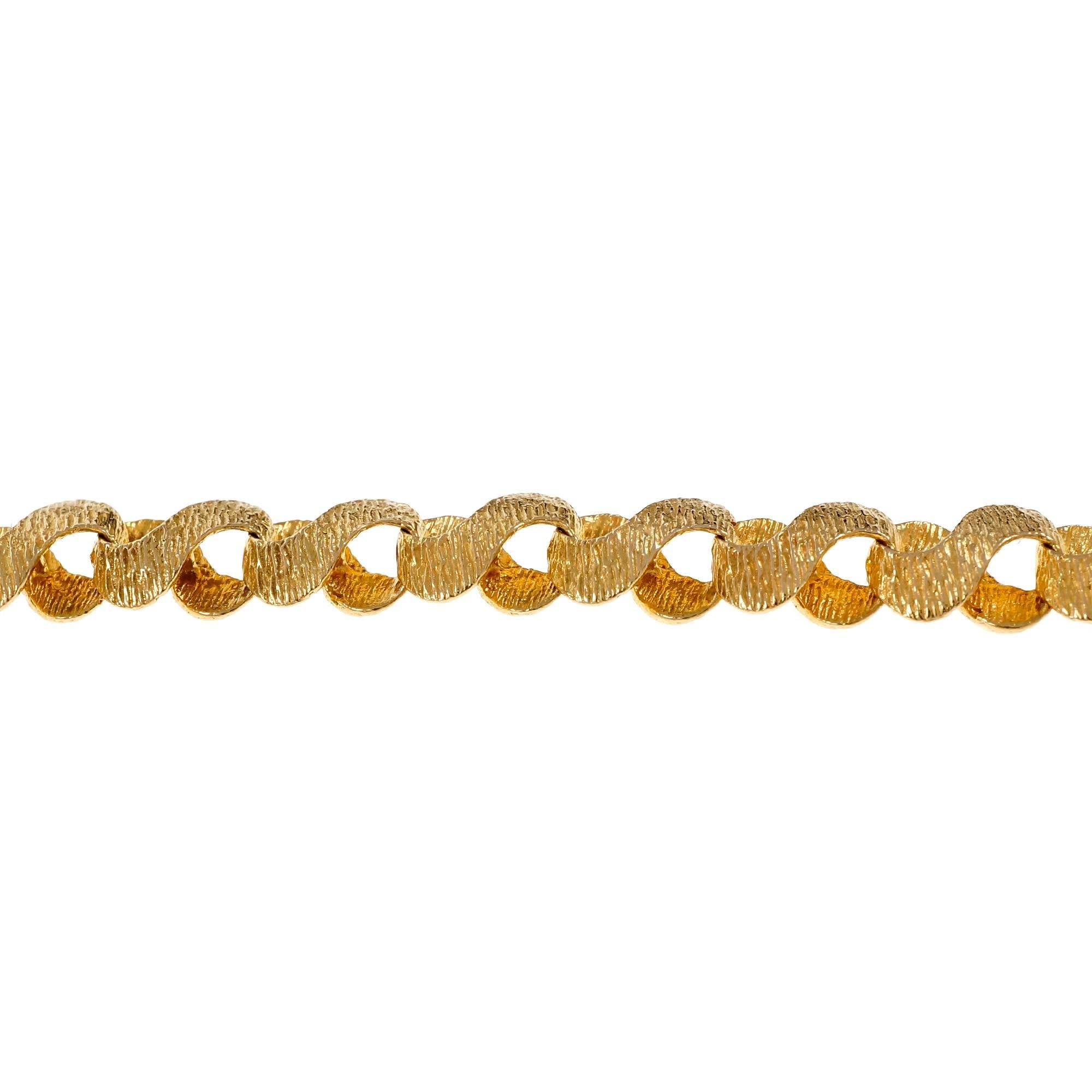 1960 vintage hand textured 14k yellow gold swirl link 18.8 inch necklace, custom finish. Not shiny.

14k yellow gold
Tested and stamped: 14k
Hallmark: ATC Italy
23.1 grams
Length: 18.5 inches – Width: 6.72mm – Depth: 3.04mm
