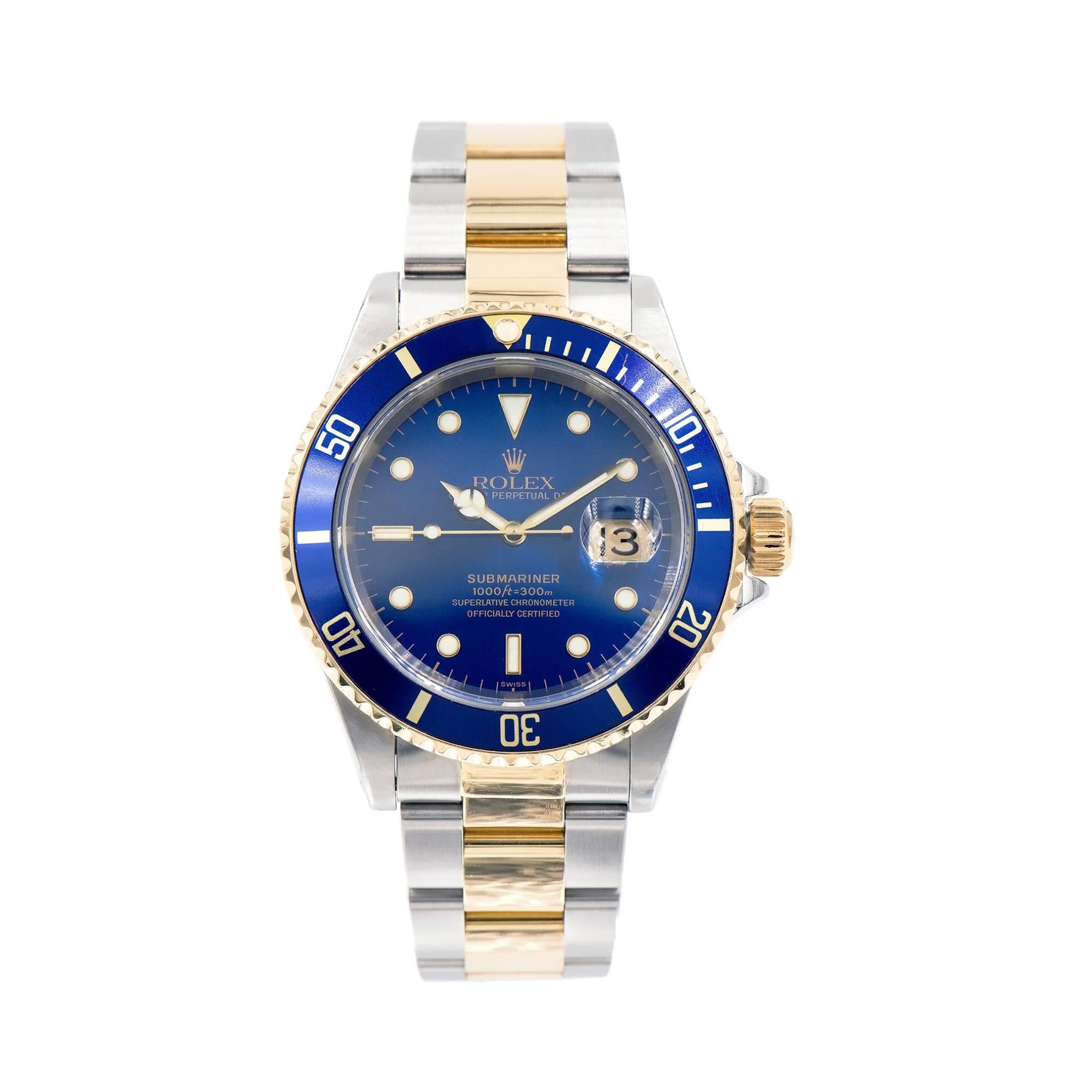 Original Rolex Submariner 18k yellow gold and stainless steel Oyster Perpetual date watch. Blue dial and bezel rim. Circa 2000, Ref 16613. 

Length: 47mm 
Width: 38mm 
Band width at case: 20mm 
Case thickness: 12.83mm 
Band: 93153-18 x 9 Rolex