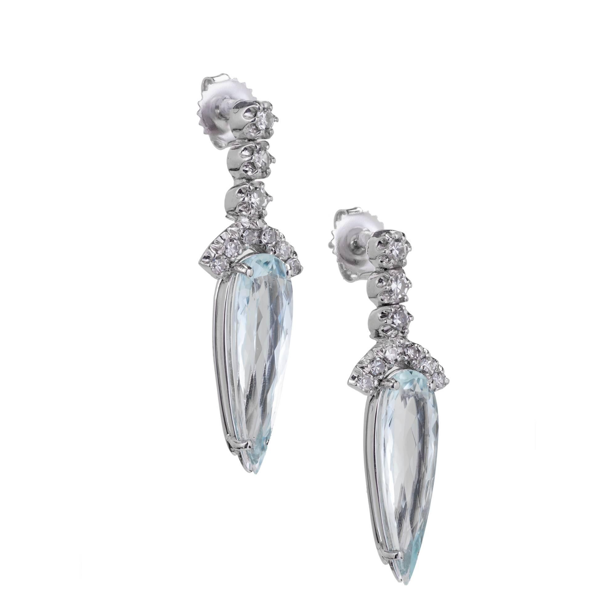 Vintage 1940s dangle earrings in 14k white gold with bright white Diamonds and natural untreated pear shaped Aquamarines.

2 pear light blue Aquamarines, approx. total weight 10.00cts
18 single cut Diamonds, approx. total weight .68cts, H, VS
14k