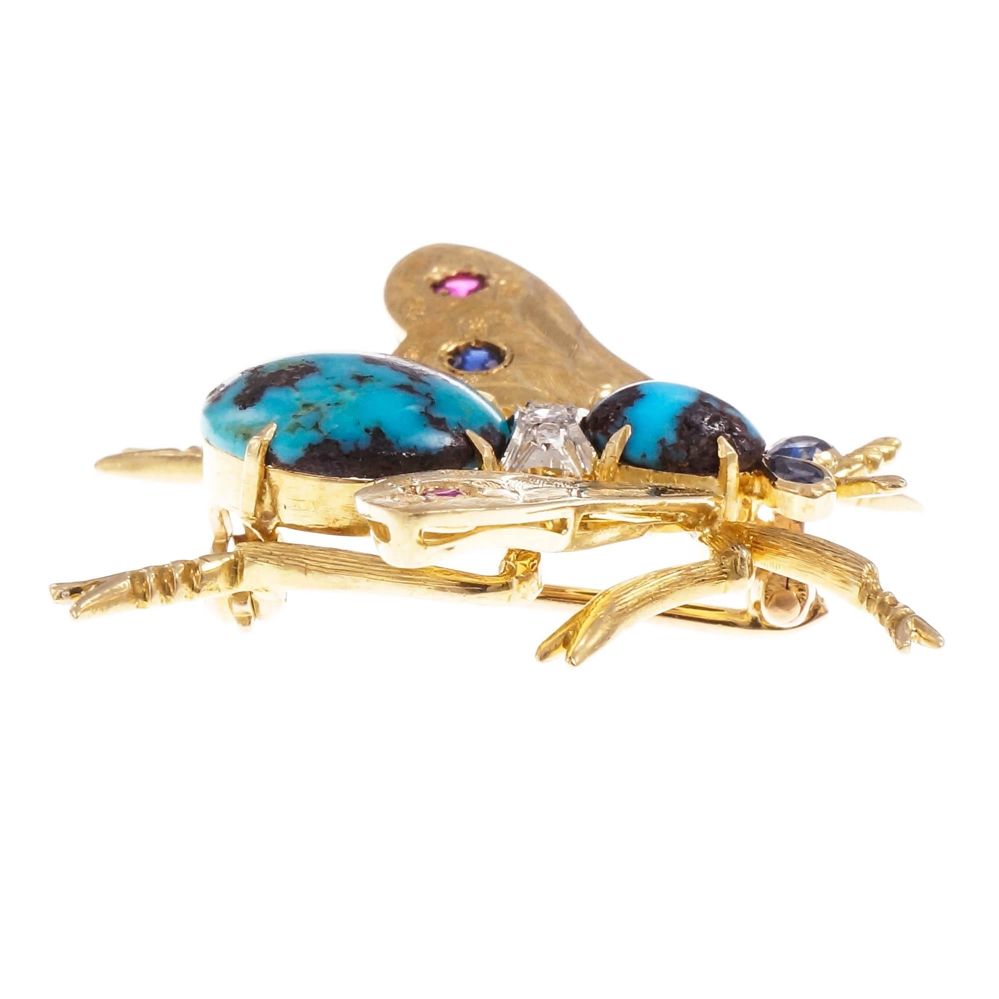 Vintage 3-D 1950 18k yellow gold bee pin with all natural untreated gemstones. Turquoise matrix, Sapphire eyes. Diamond, Ruby and Sapphire accents.

1 round cabochon Turquoise, 12 x 12 x 3.3mm
2 pear Sapphires, approx. total weight .06cts
1 oval