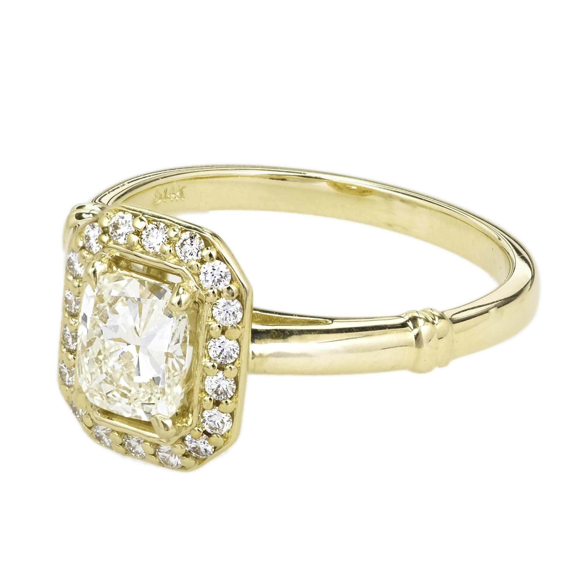 Peter Suchy elongated cushion cut Diamond engagement ring. The 14k yellow gold setting was chosen to show off the sparkle and beauty of the stone. Octagonal (8 sided) top with a delicate full cut Diamond halo rim. 

1 elongated cushion modified