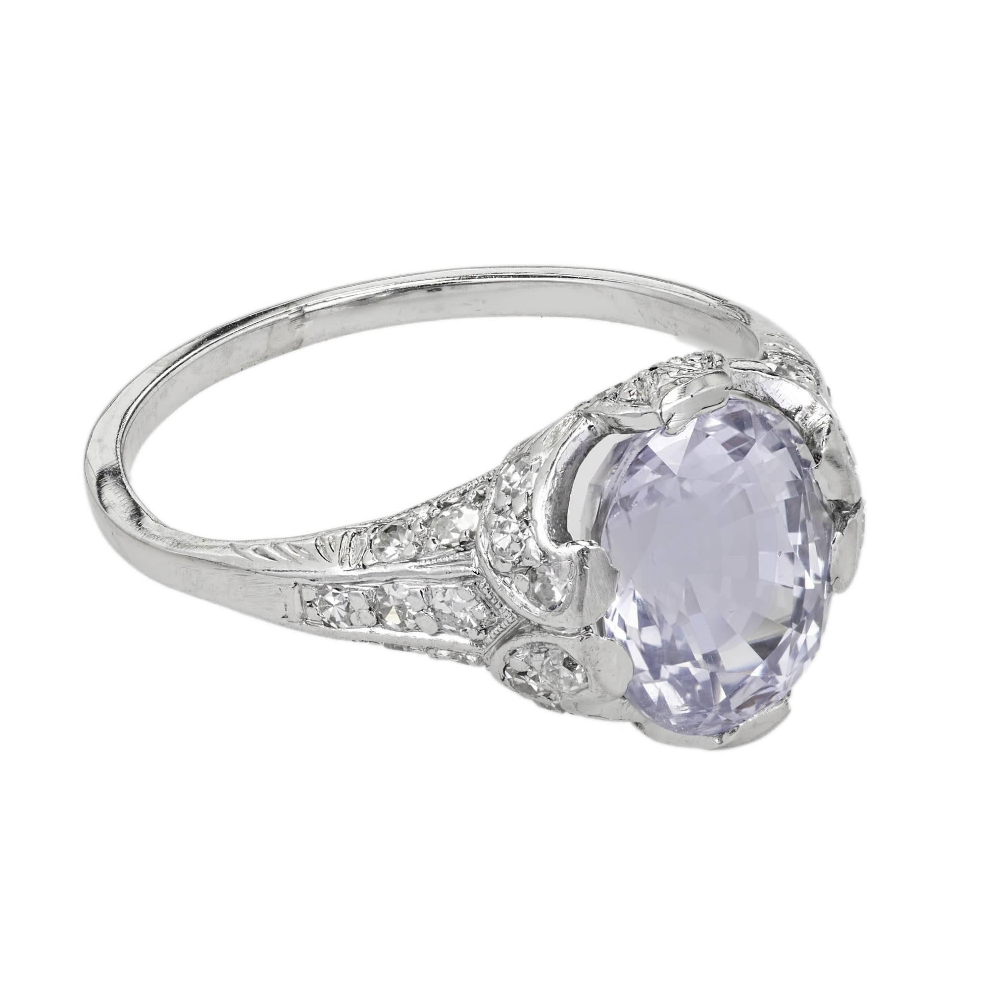 Circa 1910s GIA certified natural very light gray violet oval Sapphire in its original handmade Platinum setting with accent diamonds. 

1 modified oval very light grayish violet Sapphires, approx. total weight 3.45cts, VS2 – SI1, natural no heat