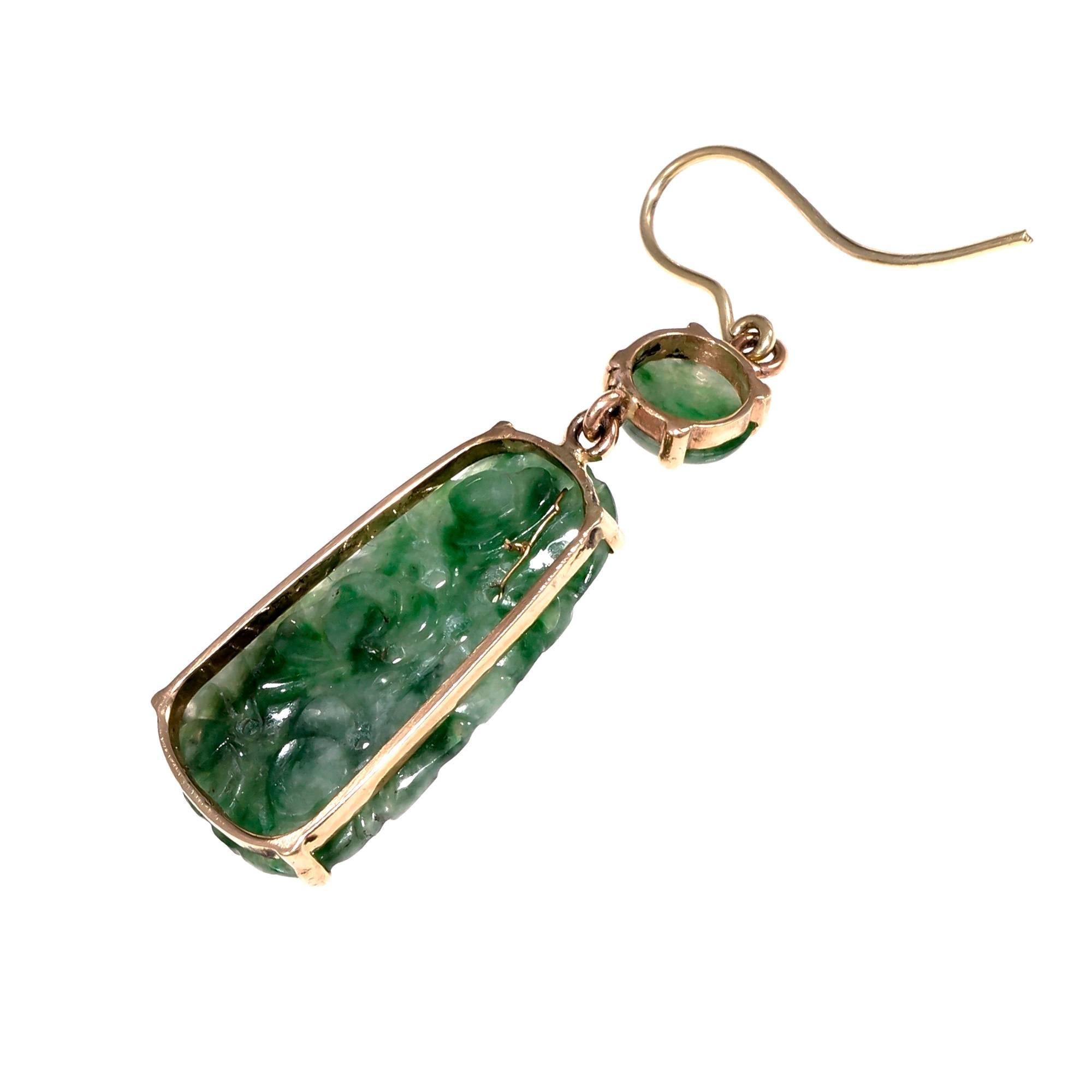 Vintage 1950-1960 Jadeite Jade natural GIA certified dangle earrings. Wire tops with a carved Jade tablet below and a round Jade cabochon. The white accent beads appear to be Jade.

2 round mottled green Jadeite Jade cabochons, translucent, 7mm
2