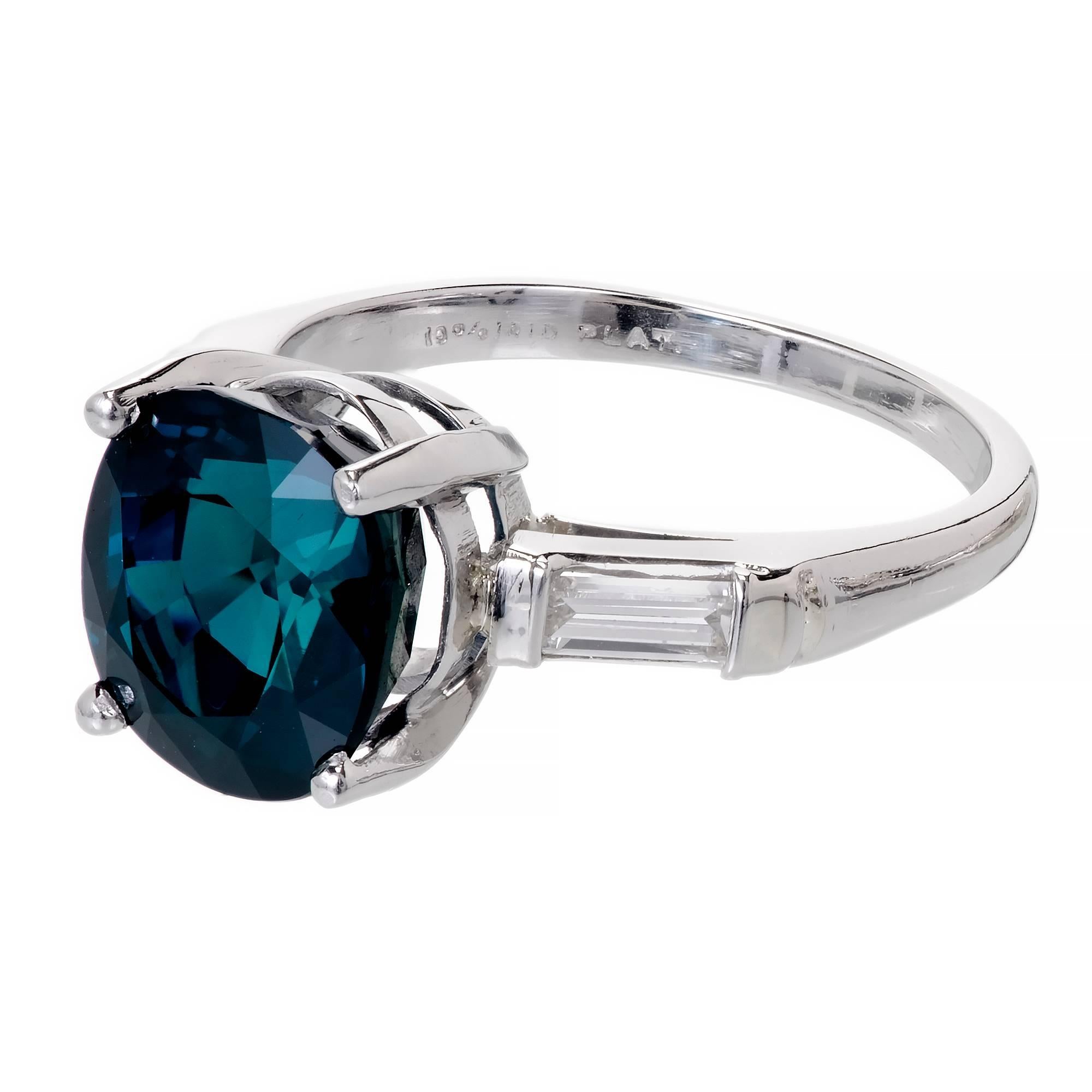 Vintage 1950-1960 6.07ct cushion cut Sapphire engagement ring with straight baguette accents in Platinum.  GIA certified natural corundum simple heat only.

1 cushion cut dark blue Sapphire, approx. total weight 6.07cts, VS2, 10.14 x 9.48 x 6.98mm,