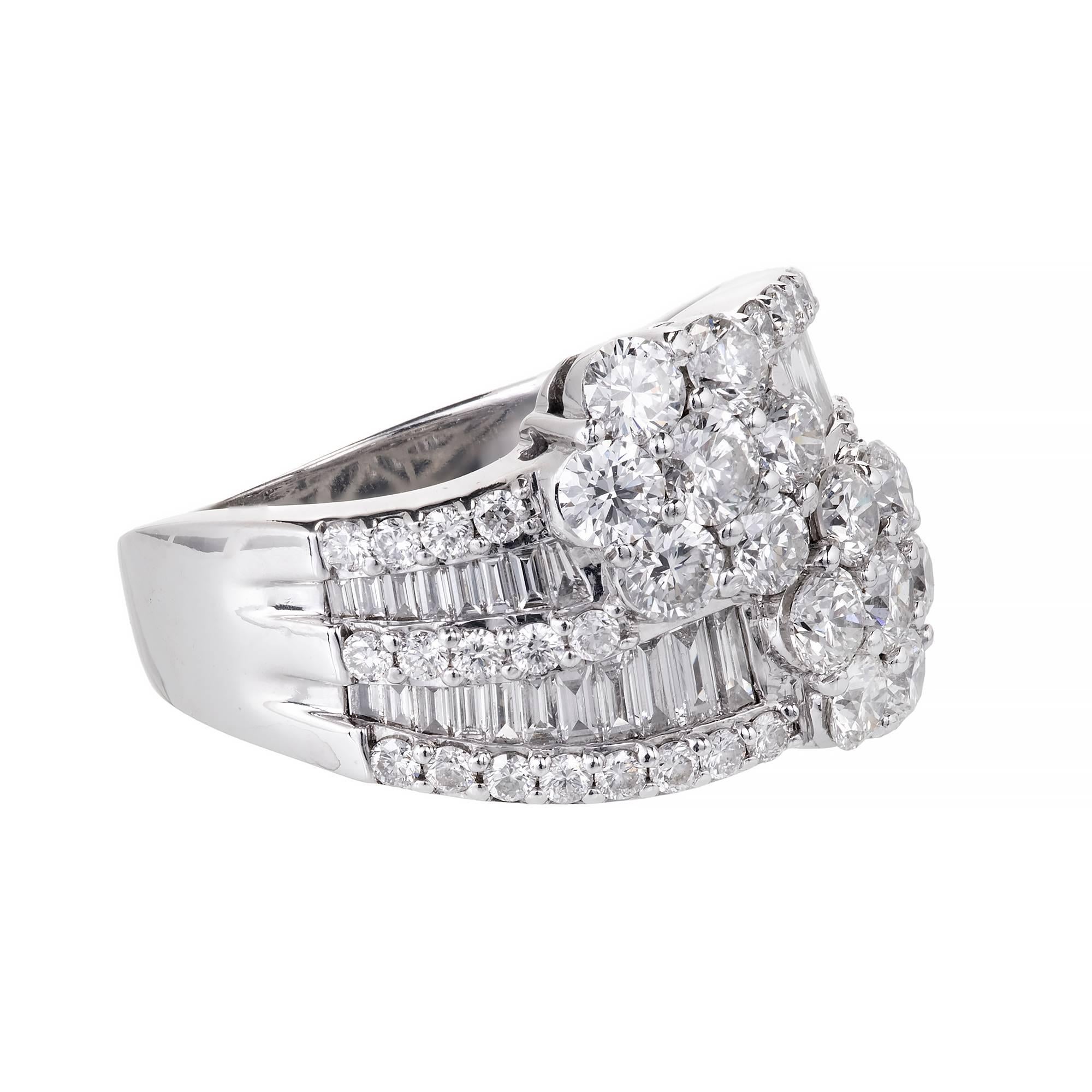 Diamond Bypass style double cluster cocktail ring with round brilliant cut and baguette cut Diamonds. Bright white sparkle.

2 round full cut Diamonds, approx. total weight .35cts, F – G, VS – SI
12 round full cut Diamonds, approx. total weight