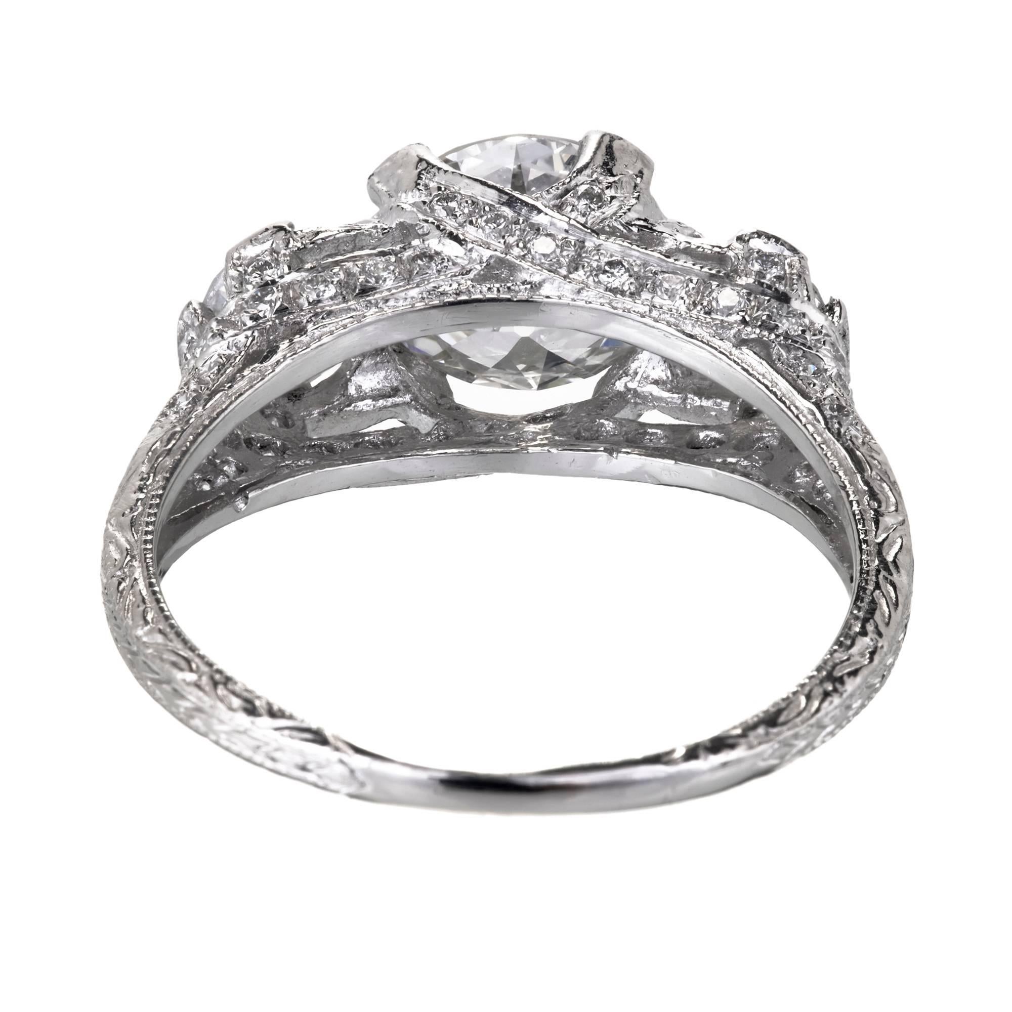 Peter Suchy Designs custom made diamond three-stone platinum engagement ring with vintage old European cut Diamonds in one of our most graceful engagement ring settings. Crafted using old world engraving.

1 old European round brilliant cut Diamond,