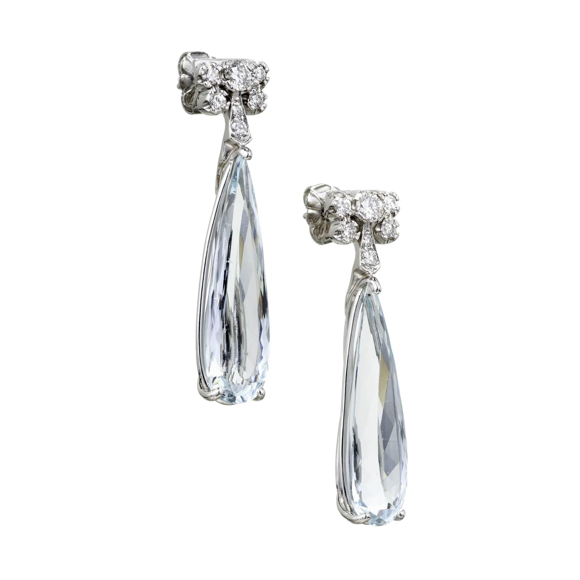 1940’s natural Aqua Platinum earrings. Handmade settings with elongated pear soft bright blue Aqua and bright white full cut Diamond accents.

2 elongated pear shaped light blue Aquamarines, approx. total weight 9.39cts, VS – SI, 24.0 x 7.4mm
14