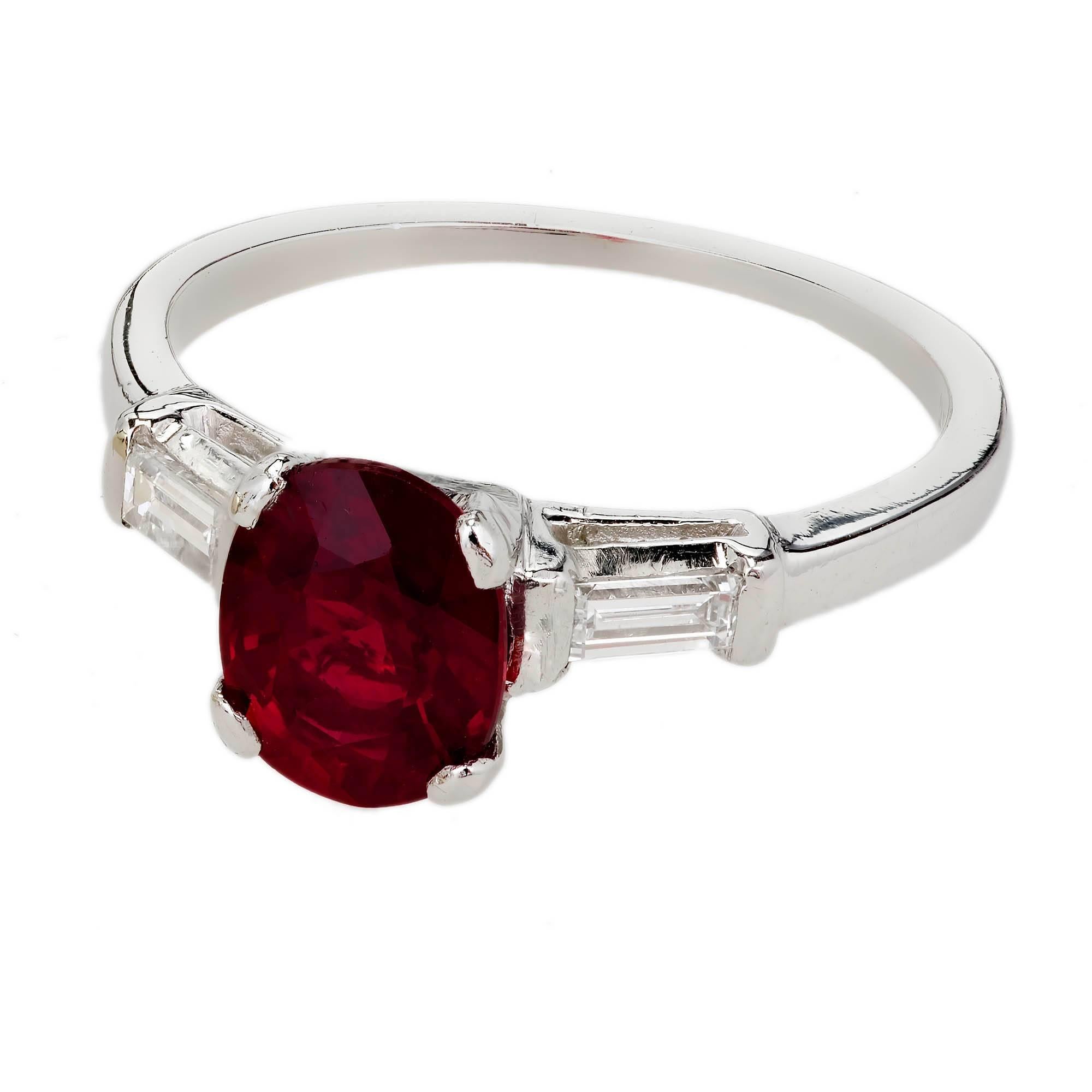 Vintage 1950’s red oval Ruby engagement ring with straight baguette accent Diamonds. GIA certified natural corundum Ruby. Heated with minor residue only.

1 oval bright red Ruby, approx. total weight 1.63cts, SI1, 7.63 x 6.07 x 4.01mm, heated minor