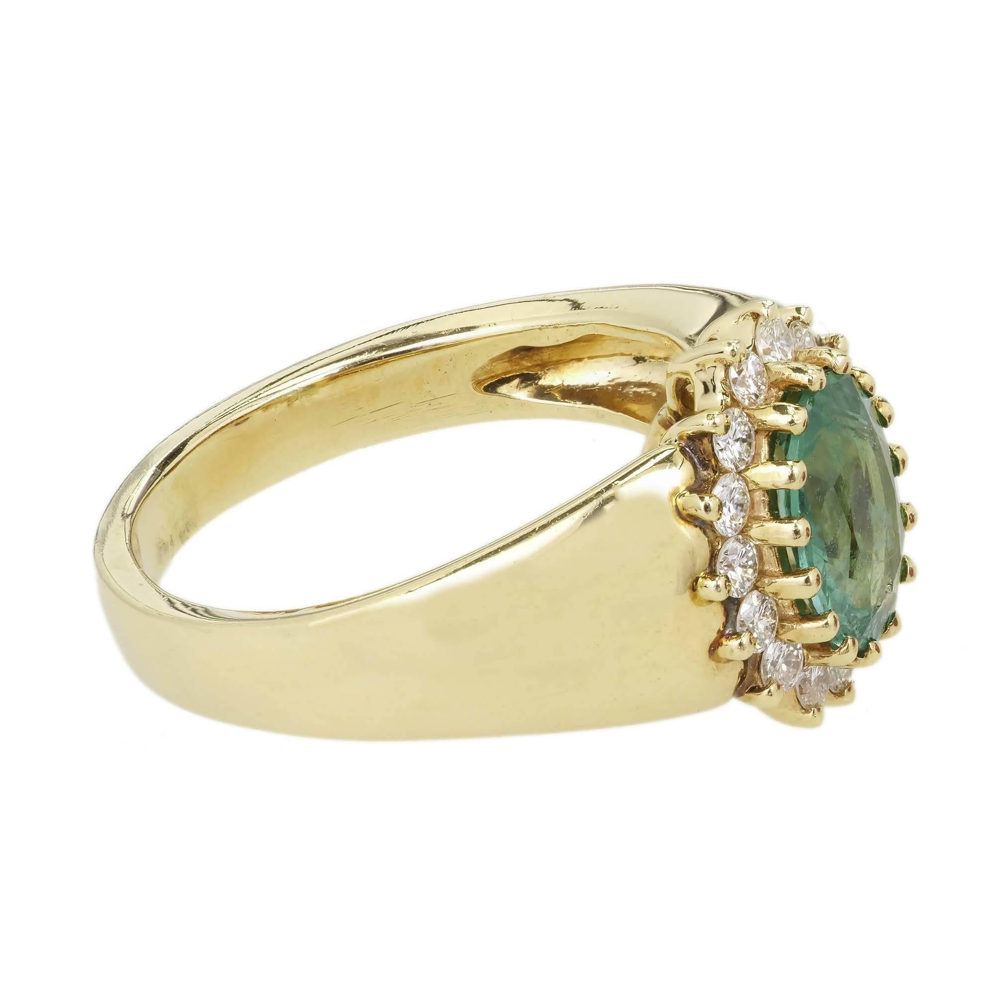  Alfred Butler classic oval Emerald and diamond engagement ring. 1.24ct oval cut center emerald set in a 14k yellow gold setting with a halo of 15 round brilliant cut diamonds. Alfred Butler was known as one of America’s finest manufacturing