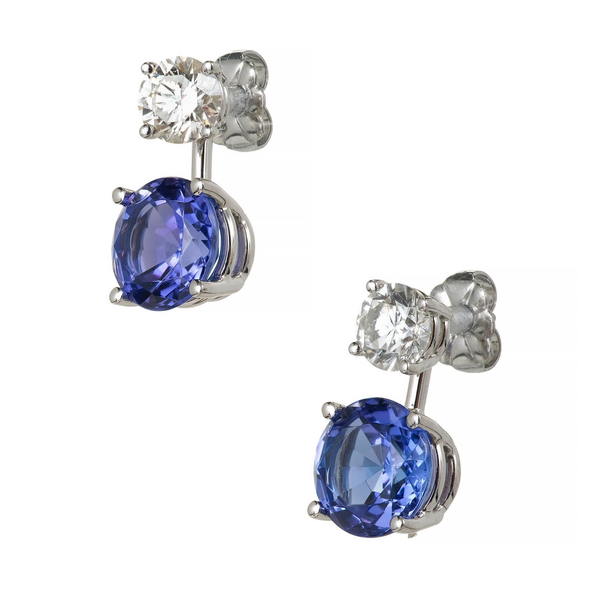Peter Suchy Jewelers custom design Diamond and Tanzanite dangle earrings. The Diamond studs can be worn alone or with the detachable bright blue Tanzanite dangles. Platinum custom made settings.

2 round brilliant cut Diamonds, approx. total weight