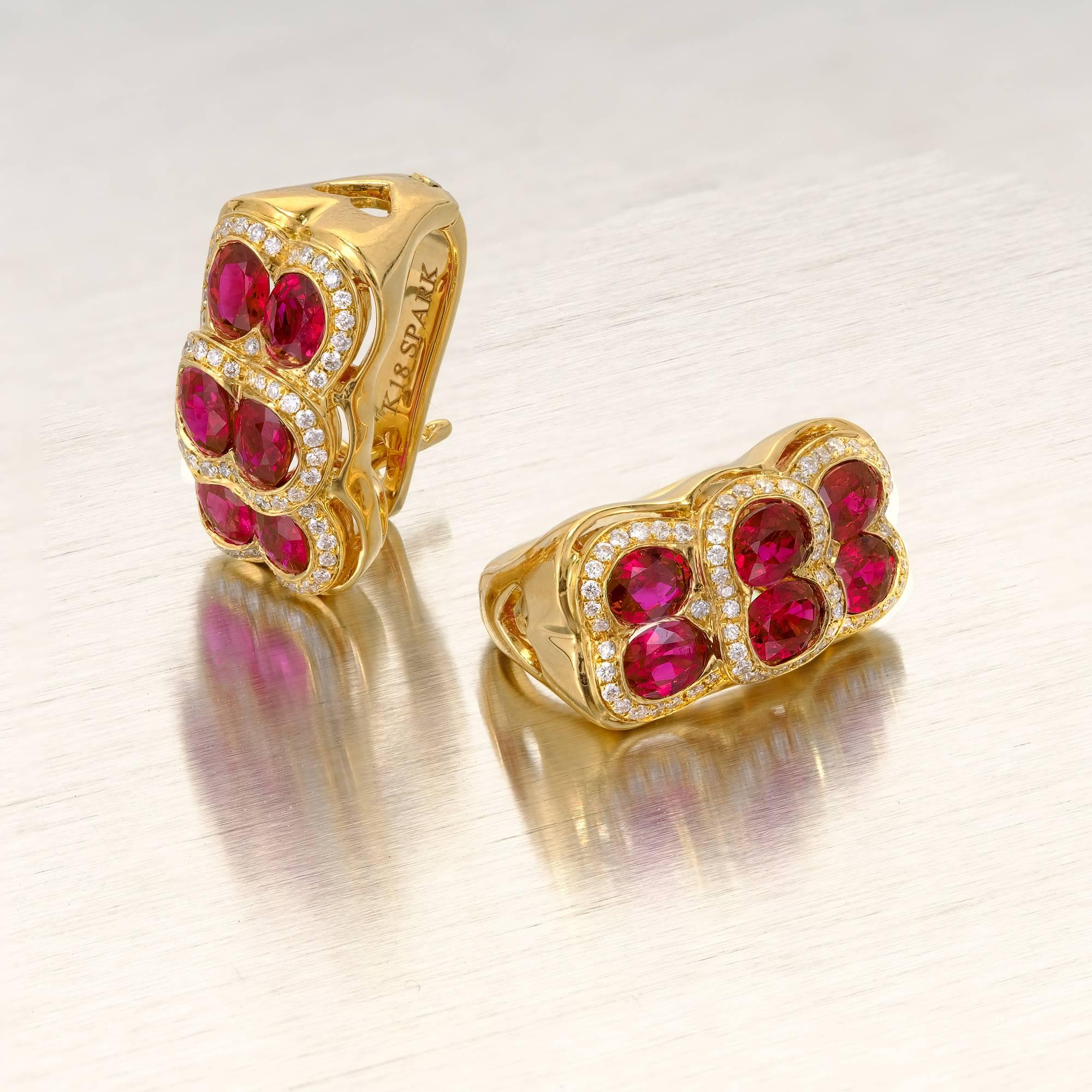 Ruby and diamond simple clip post earrings from Spark, in 18k yellow gold.  Circa 1980-1990.

12 gem bright red Rubies, approx. total weight .76cts, VS-SI
128 full cut diamonds, approx. total weight .33cts, F, VS
18k yellow gold
9.7 grams
Tested: