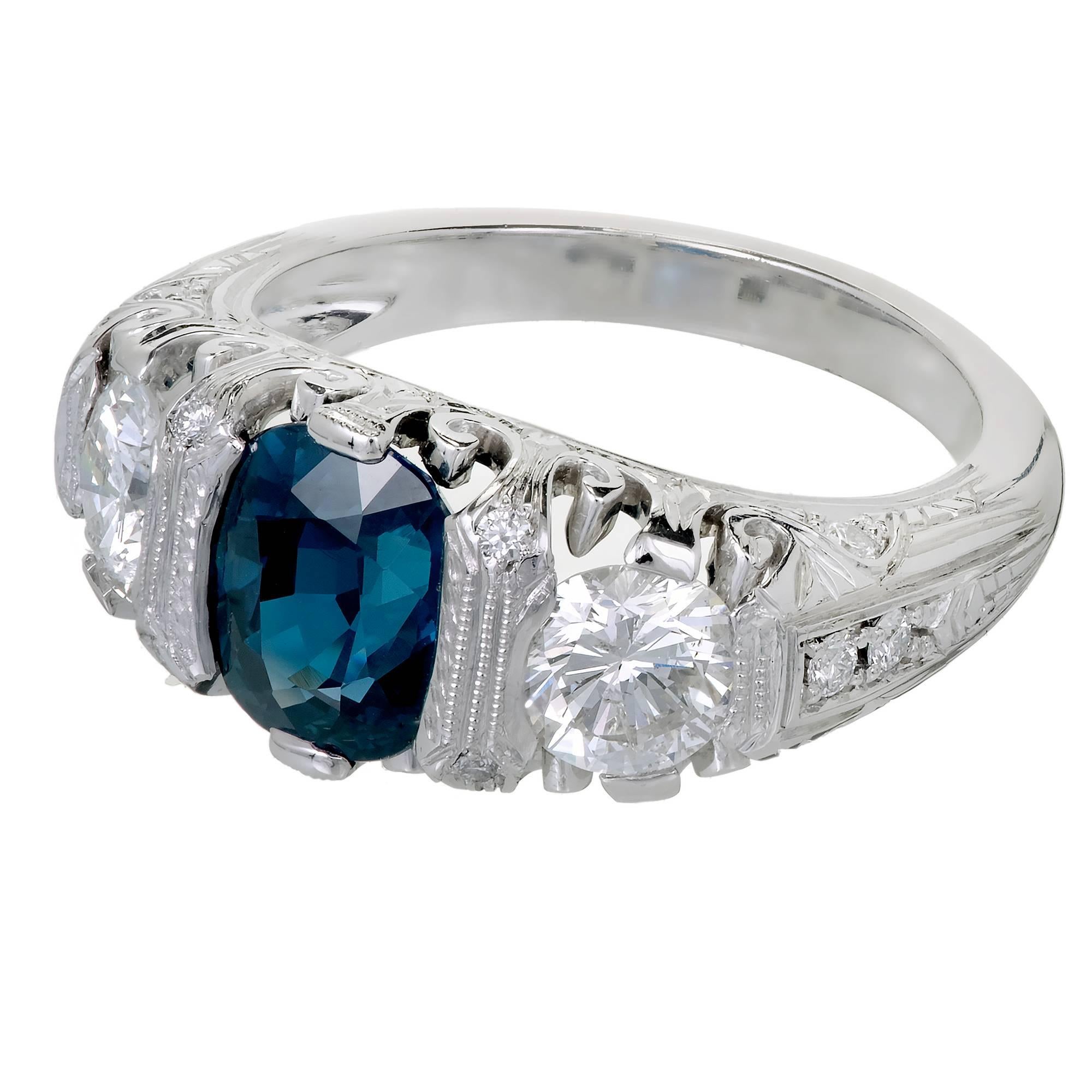 Peter Suchy Designs antique inspired Platinum engagement ring. Styled after an original 1900’s handmade 3 stone dome ring and made with the same handmade techniques. The center Sapphire is an antique cushion cut GIA graded Sapphire as natural, no