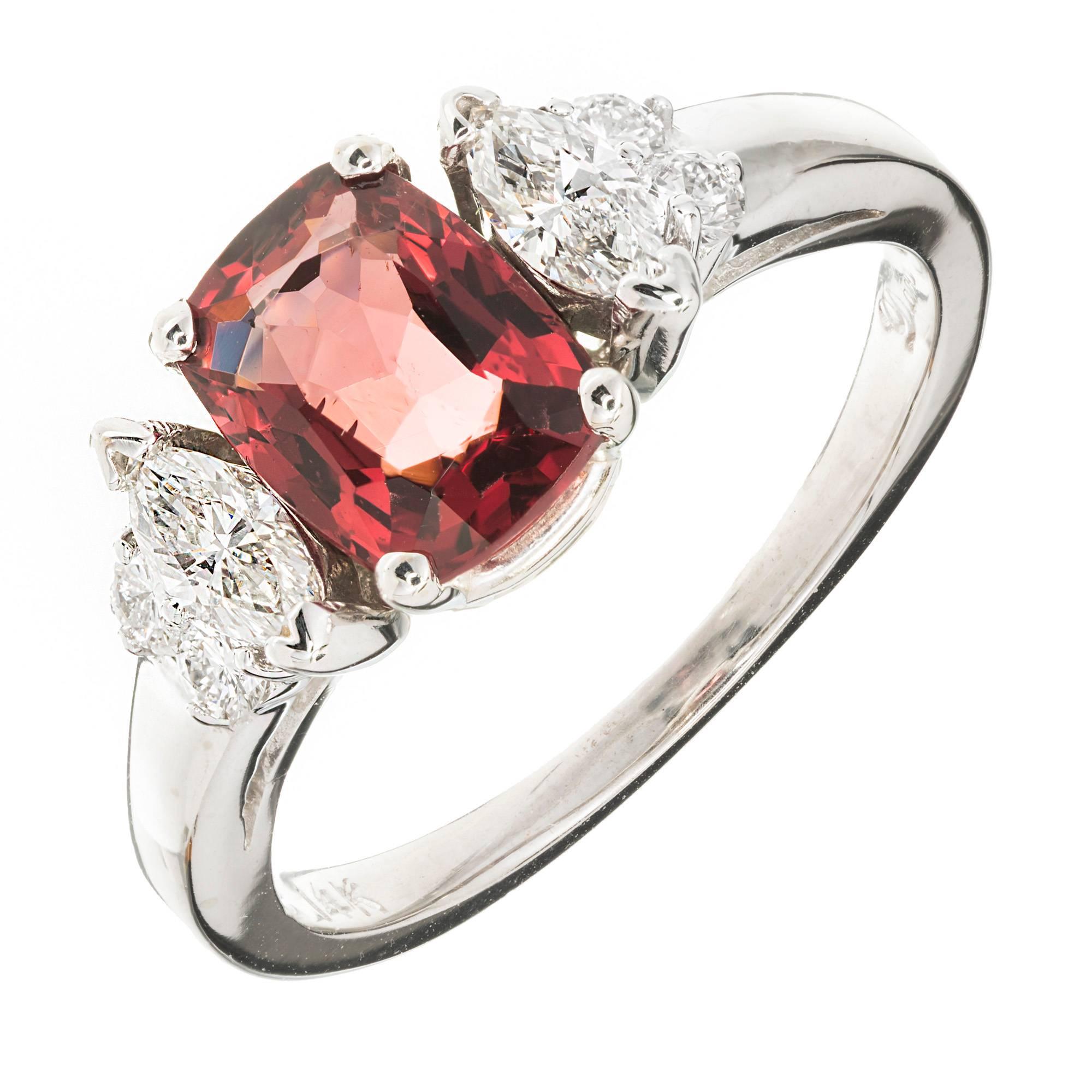 Designer Dana Bright orange red Spinel and diamond 14k white gold three-stone engagement ring. GIA certified. 

1 cushion cut orangey red Spinel, approx. total weight 1.39cts, VS, 4.72 x 3.52 x 1.90mm. GIA 2155137451
4 round full cut diamonds,