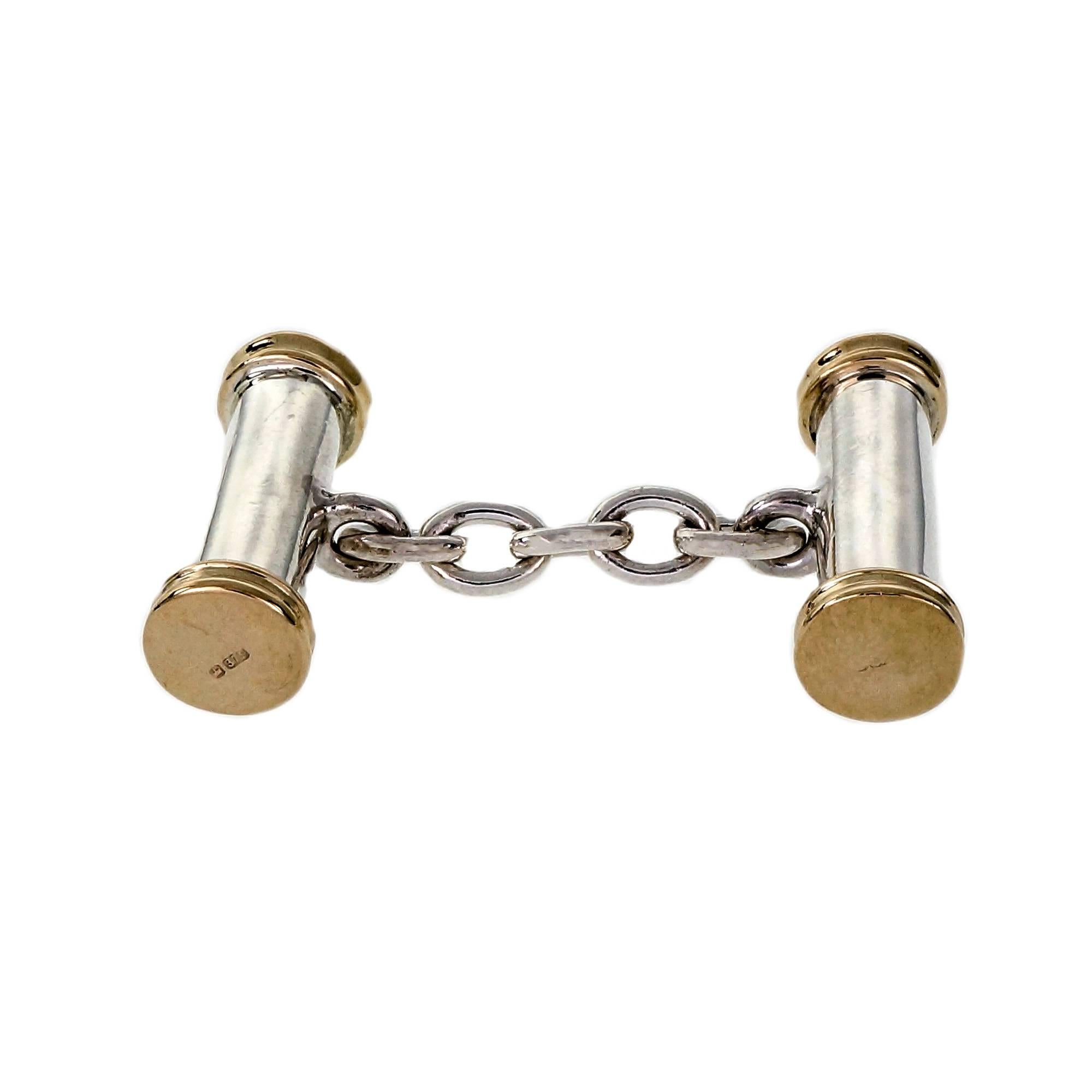 Handmade English cufflinks in solid Sterling silver and 9k yellow gold from PGK. English hallmarks.

9k yellow gold and silver
Top to bottom: 19.51mm or .77 inch
Width: 6.56mm or .26 inch
Depth: 6.66mm
19.2 grams
Tested: 9k & silver
Stamped: