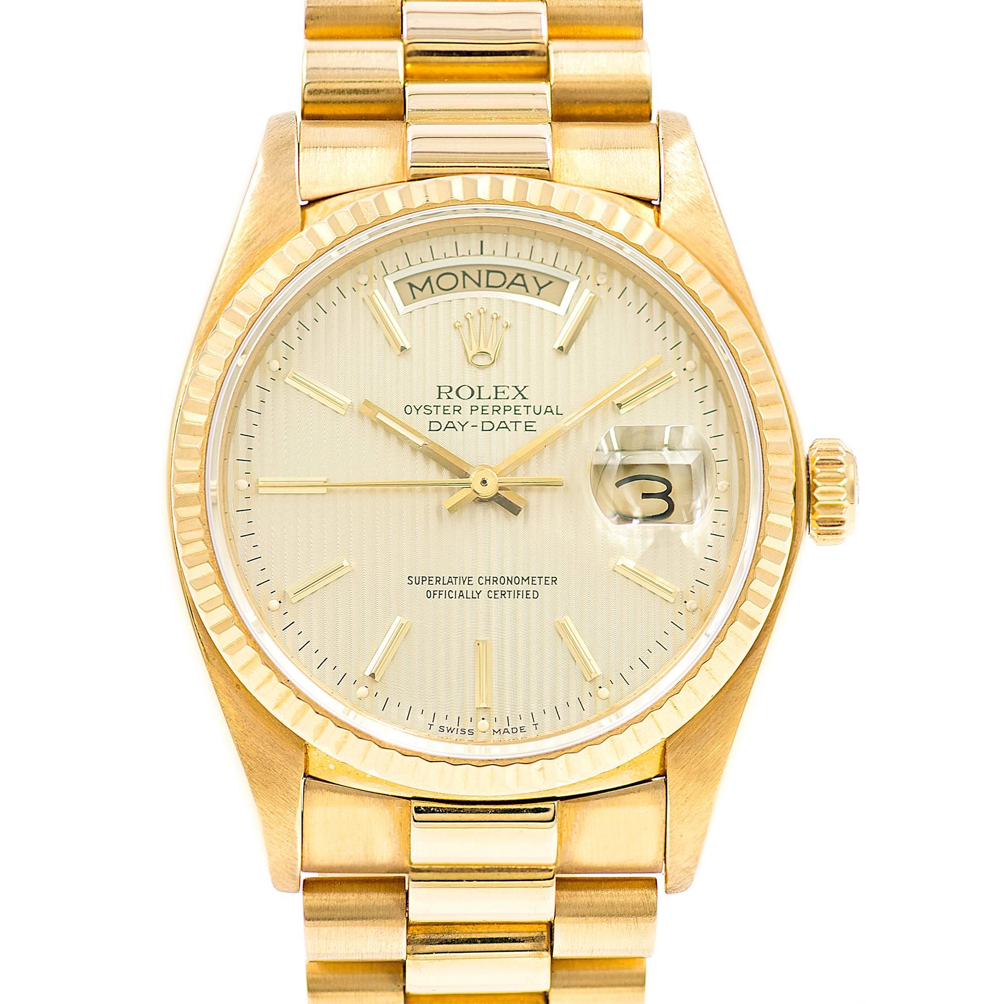 Gently pre-owned Rolex President 18038 Day Date Automatic wrist watch all factory original with beautiful champagne tapestry stripe dial and excellent band with little stretch. Completely reconditioned and serviced. Circa 1980. 

18k yellow gold 