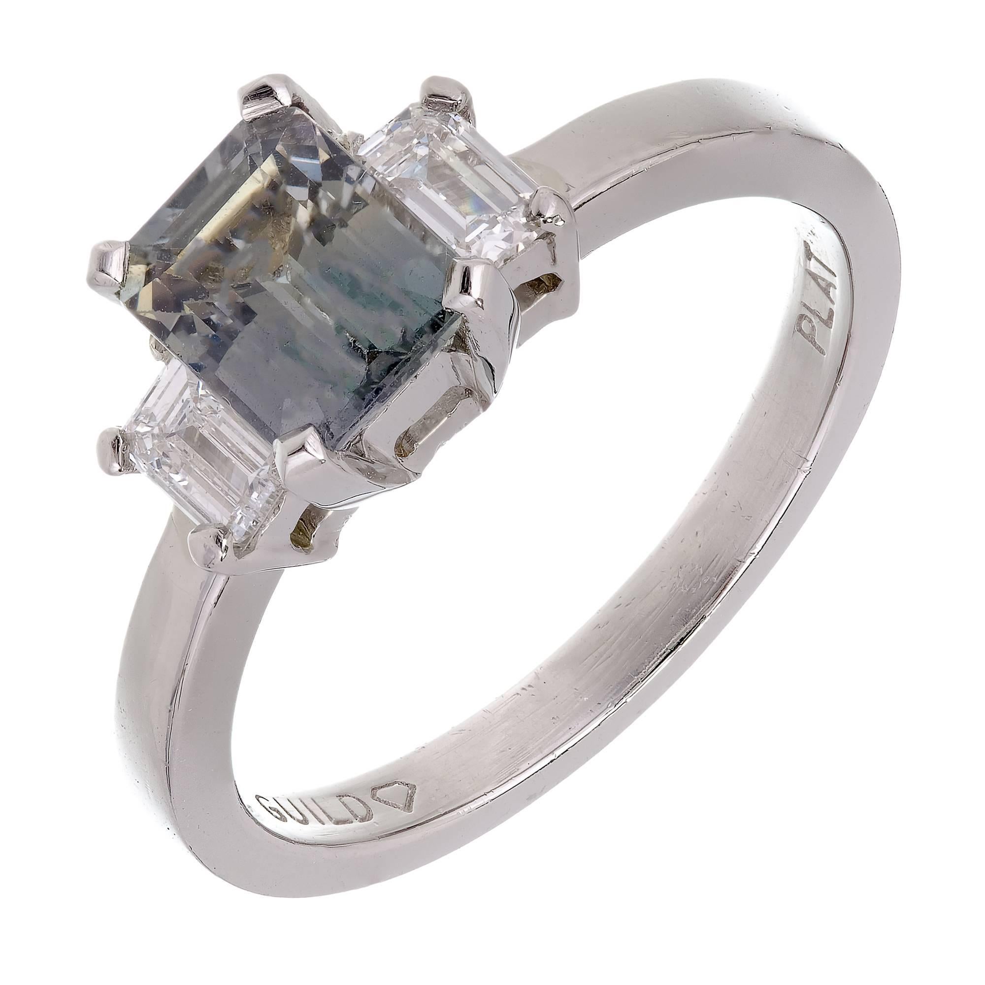 Vintage 1940-1950 Three-stone Platinum ring with a natural no heat Emerald cut bluish green Sapphire and two emerald cut side diamonds. GIA certified 

1 Emerald cut light bluish green Sapphire, approx. total weight 1.42cts, no heat, GIA certificate